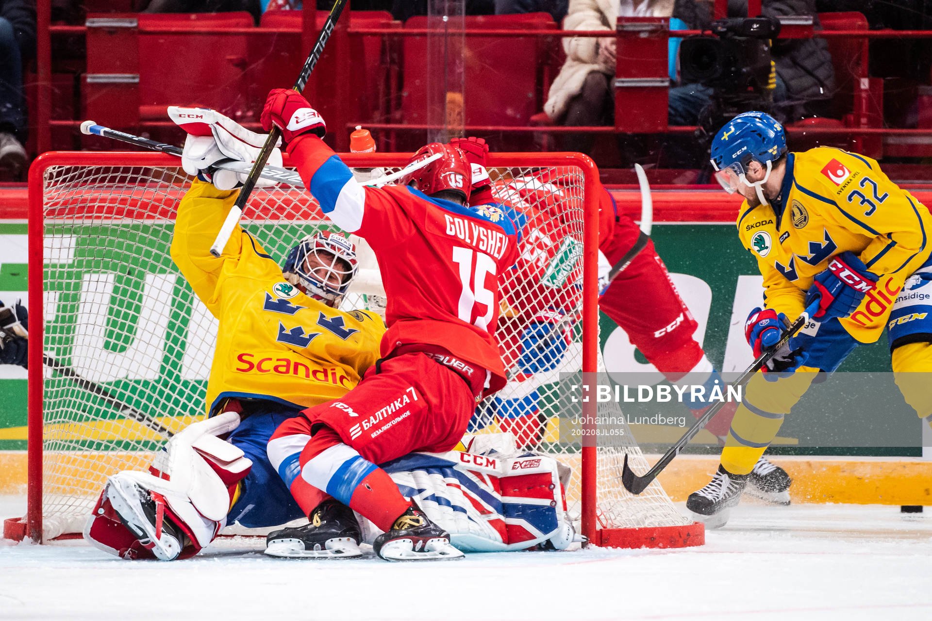 Goaltender Lars Johansson of Sweden and Anatoly Golyshev of