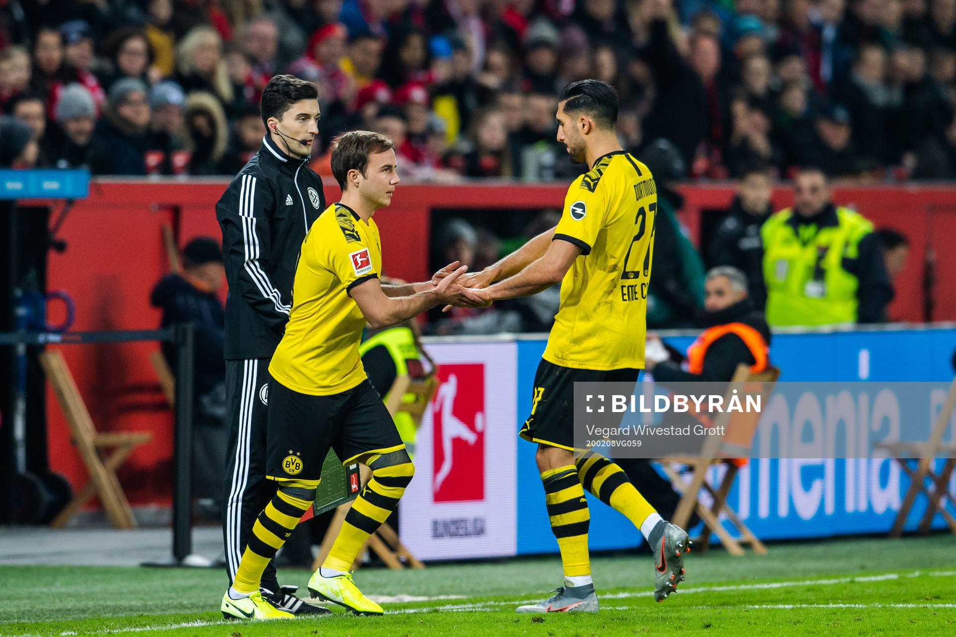 Mario Götze changes with Marius Wolf of Borussia Dortmund