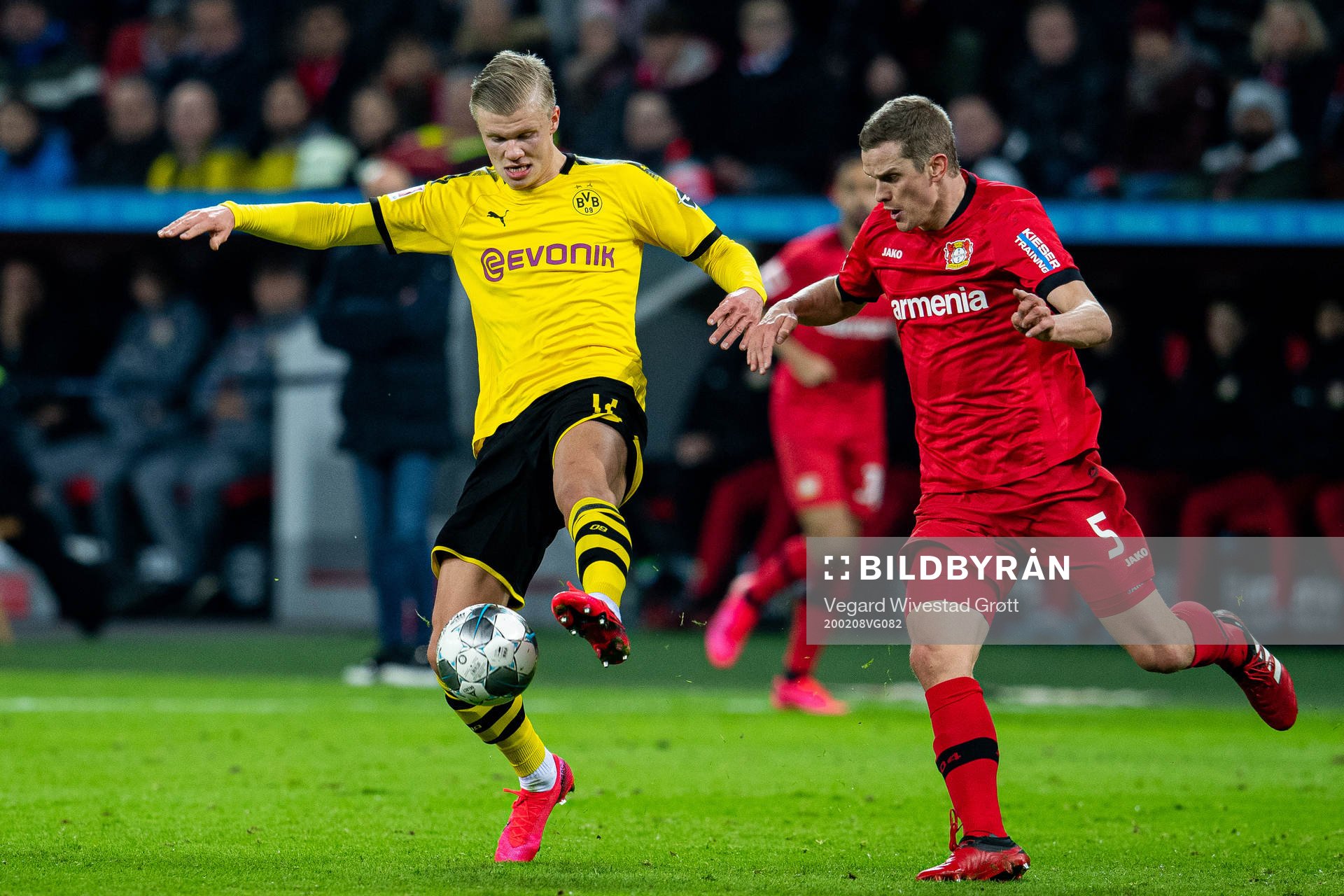 Erling Braut Haaland of Borussia Dortmund and Sven Bender