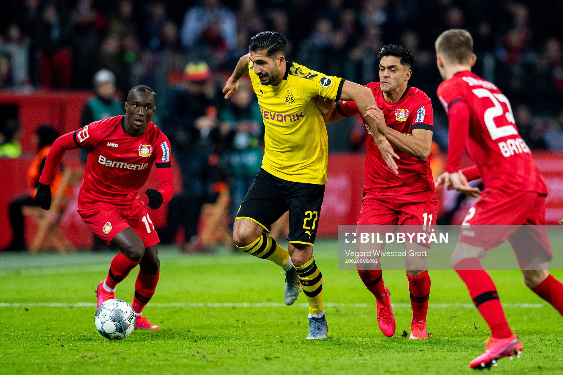 Moussa Diaby of Bayer Leverkusen, Emre Can of Borussia Dortmund and Nadiem Amiri of Bayer Leverkusen during the Bundesliga football match between Bayer Leverkusen and Borussia Dortmund on February 8, 2020 in Leverkusen.