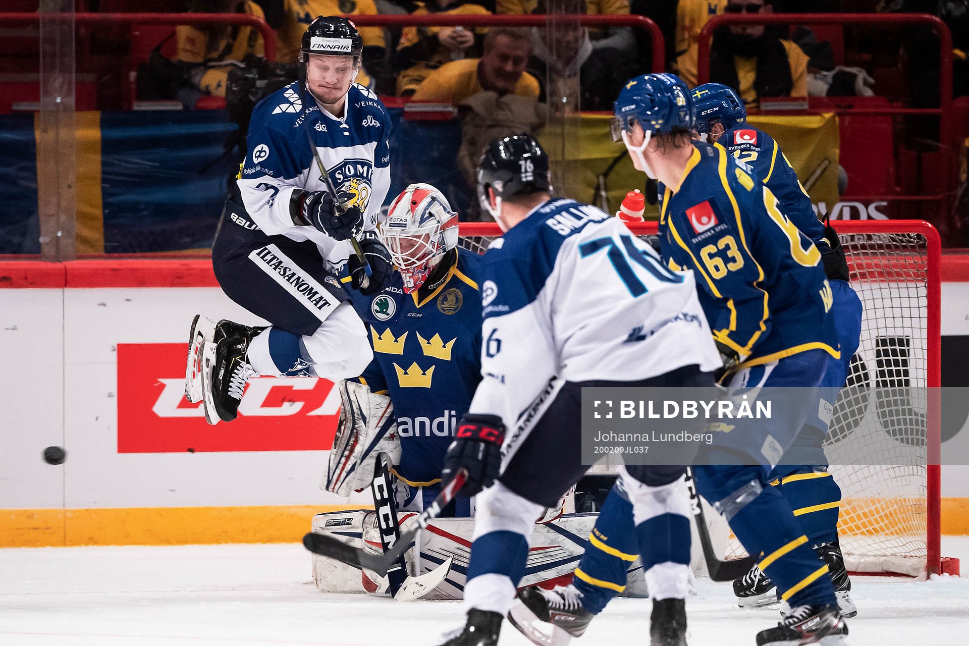 Teemu Pulkkinen of Finland and goaltender Magnus Hellberg