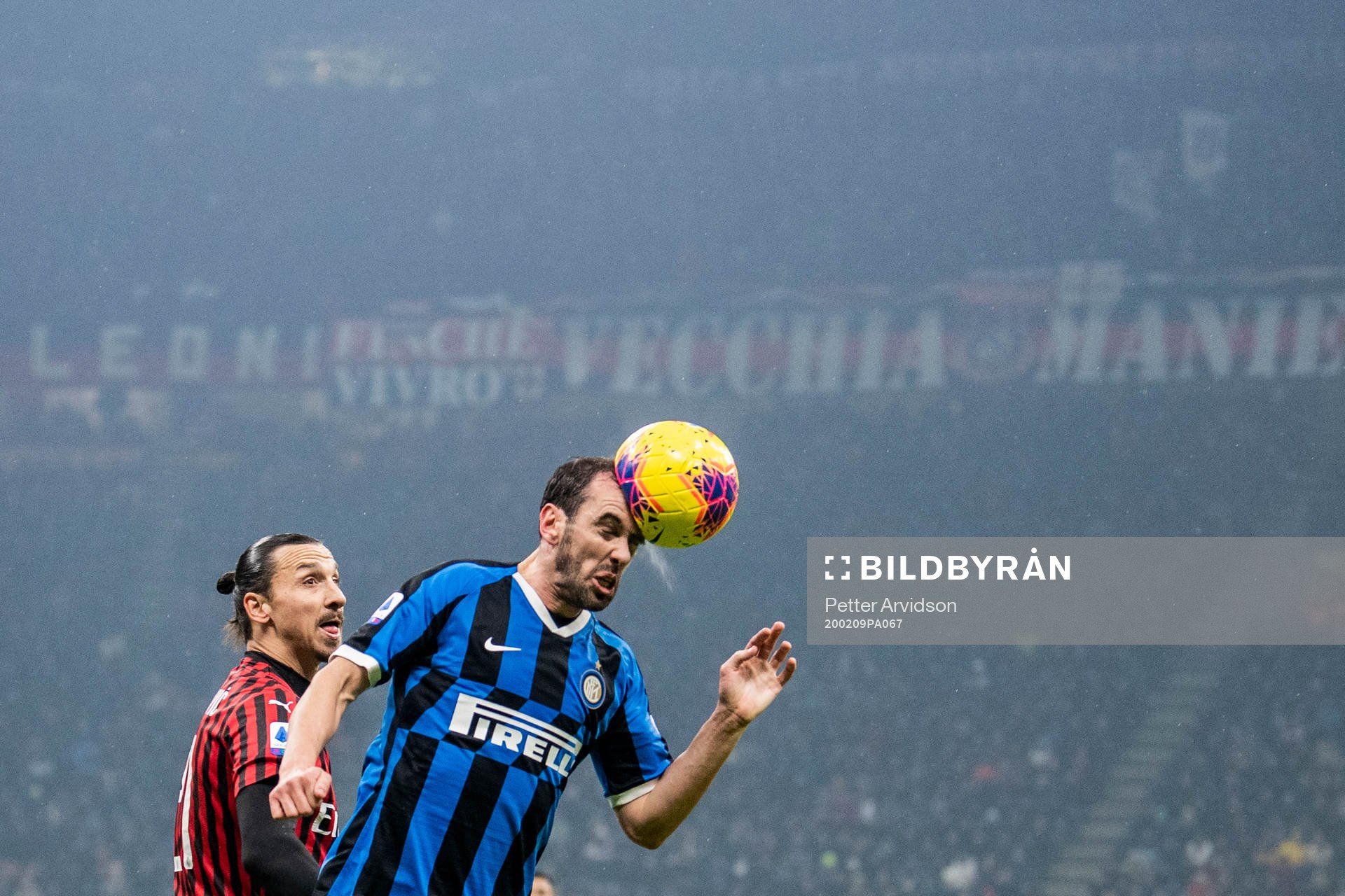 Diego Godin of Inter and Zlatan Ibrahimovic of Milan