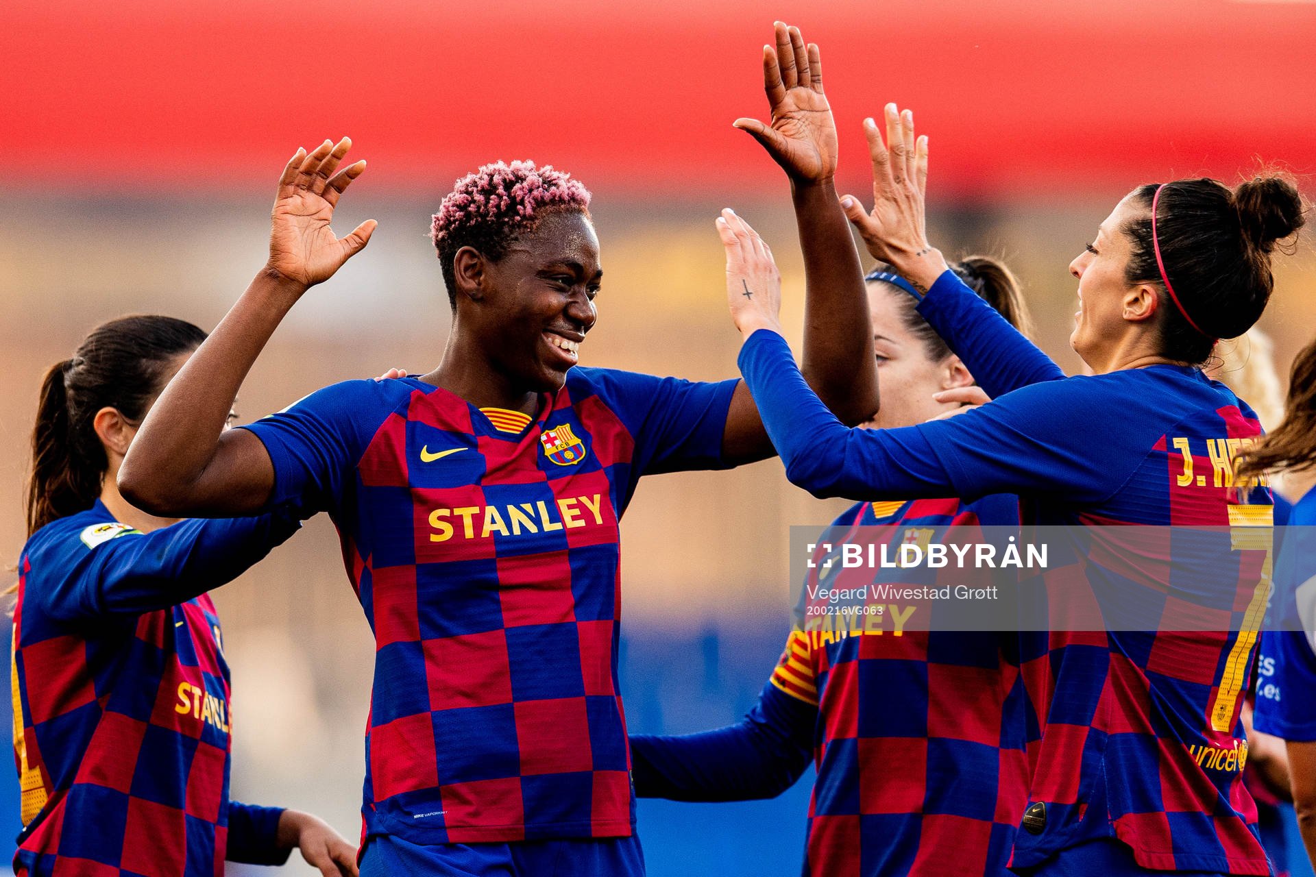 Asisat Oshoala of Barcelona celebrates with teammates