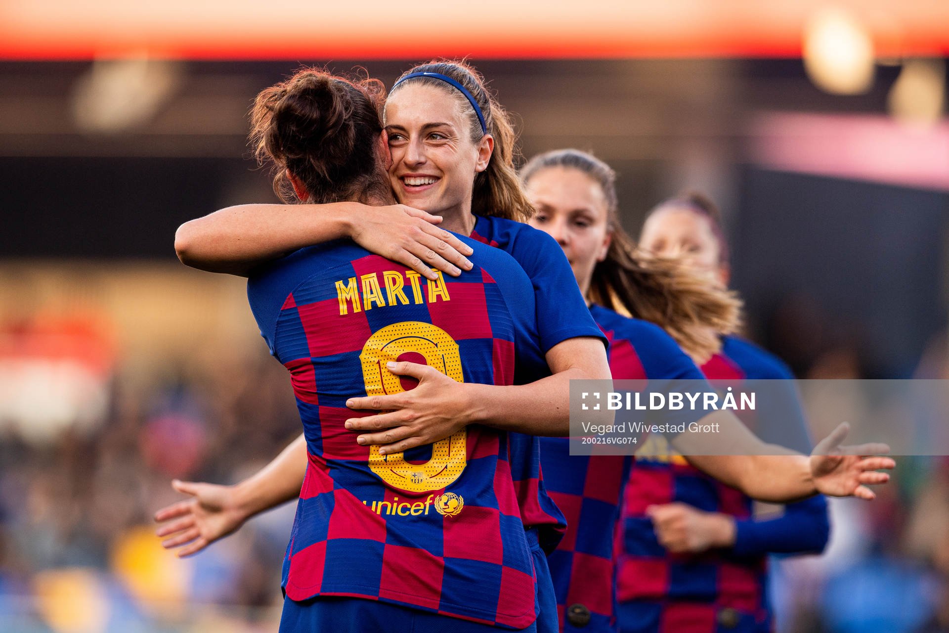 Alexia Putellas of Barcelona celebrates with teammate Marta