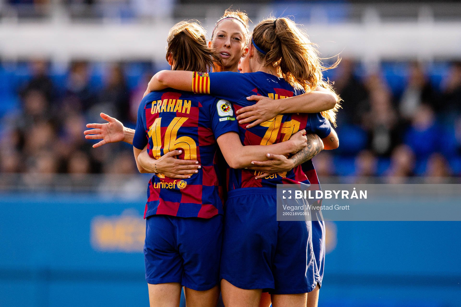 Caroline Graham Hansen of Barcelona celebrates with teammates Jenni Hermoso and Alexia Putellas after scoring 1-0 during the Primera Division Femenina football match between Barcelona and Sporting Huelva on February 16, 2020 in Barcelona.