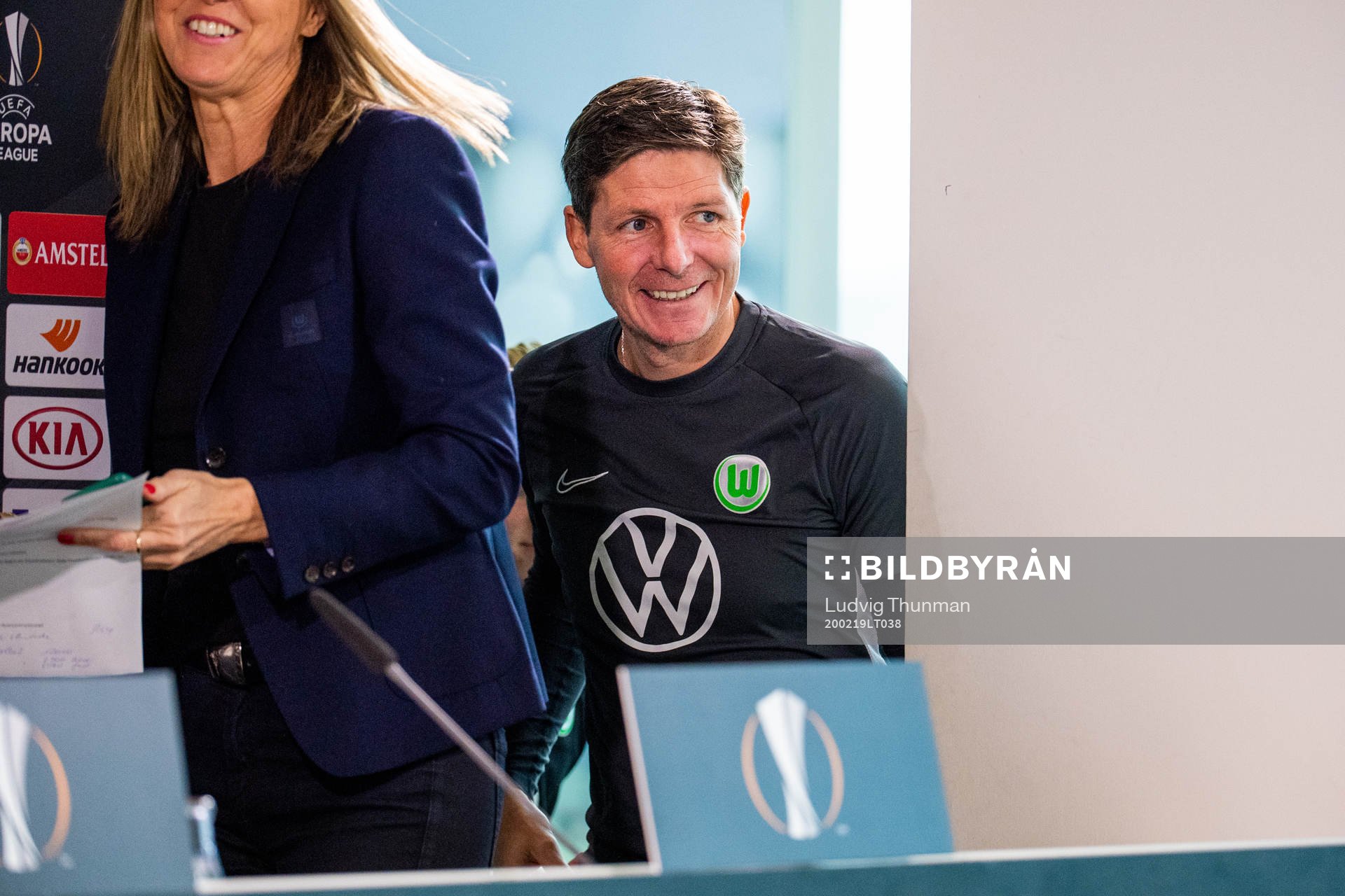 Head coach Oliver Glaser arrives for a press conference