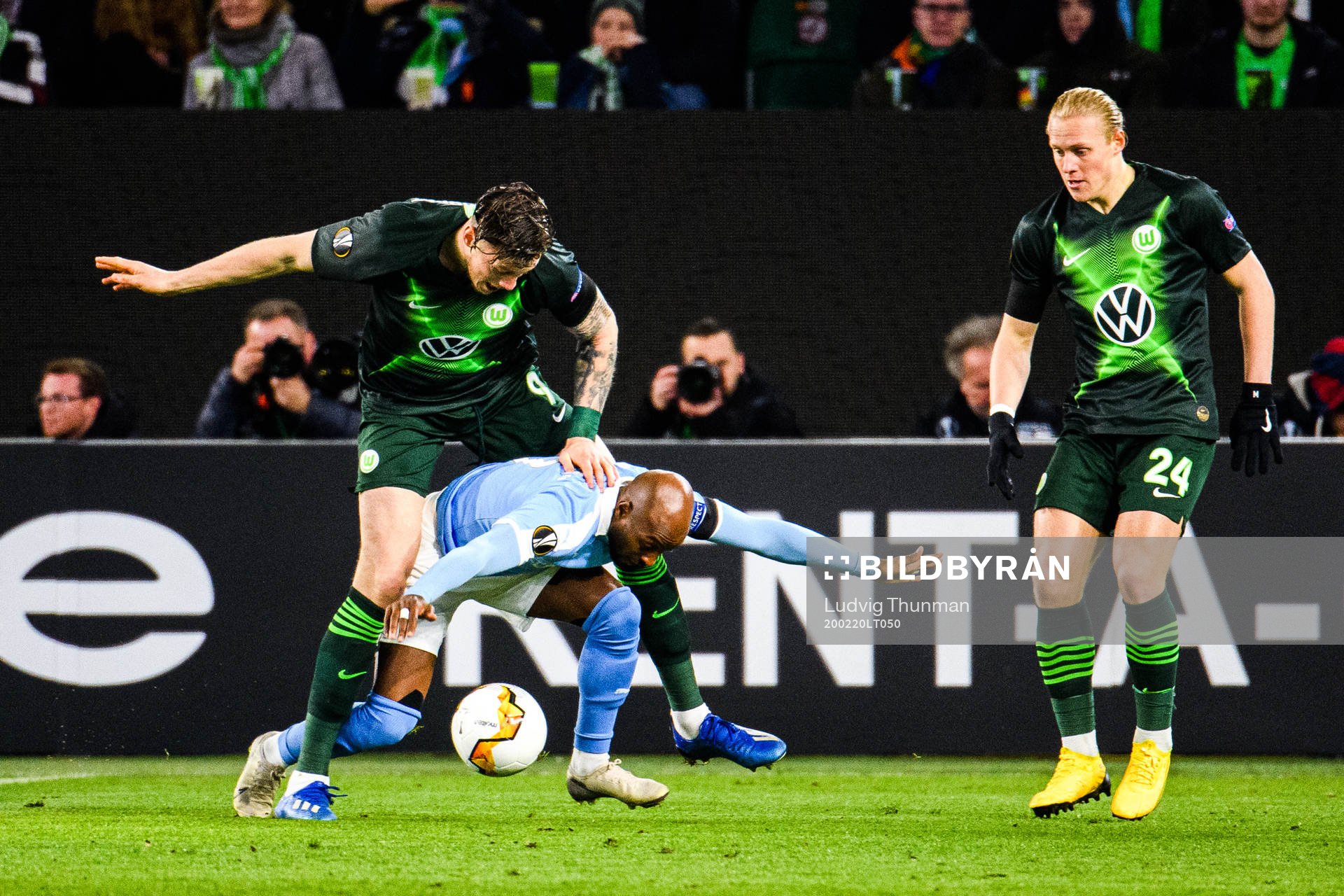 Fouad Bachirou of Malmö FF and Wout Weghorst of Wolfsburg during the Europa League round of 32 match between Wolfsburg and Malmö FF on February 20, 2020 in Wolfsburg.