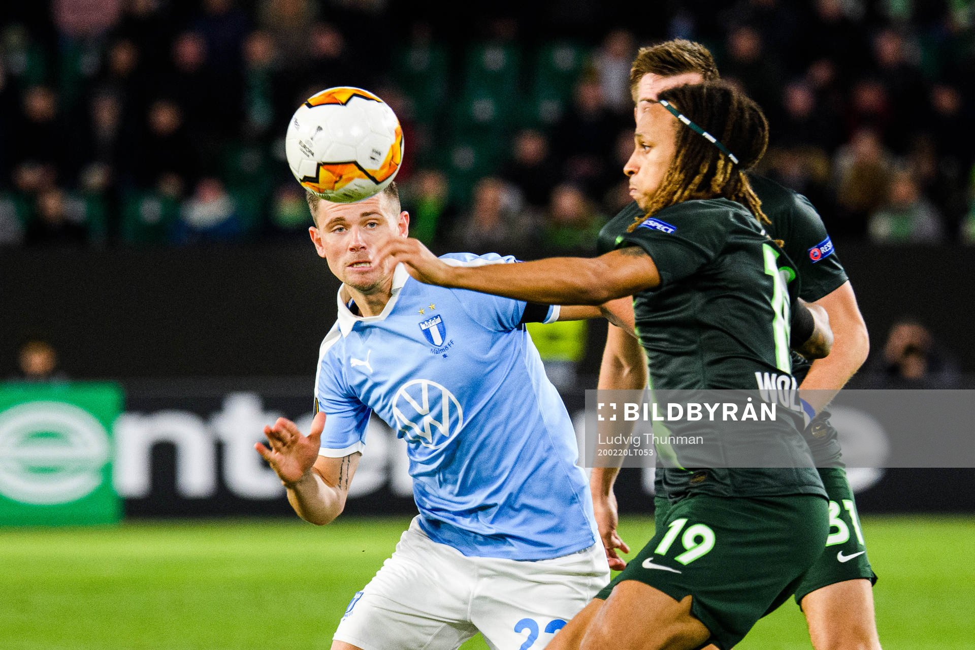 Marcus Antonsson of Malmö FF and Kevin Mbabu of Wolfsburg