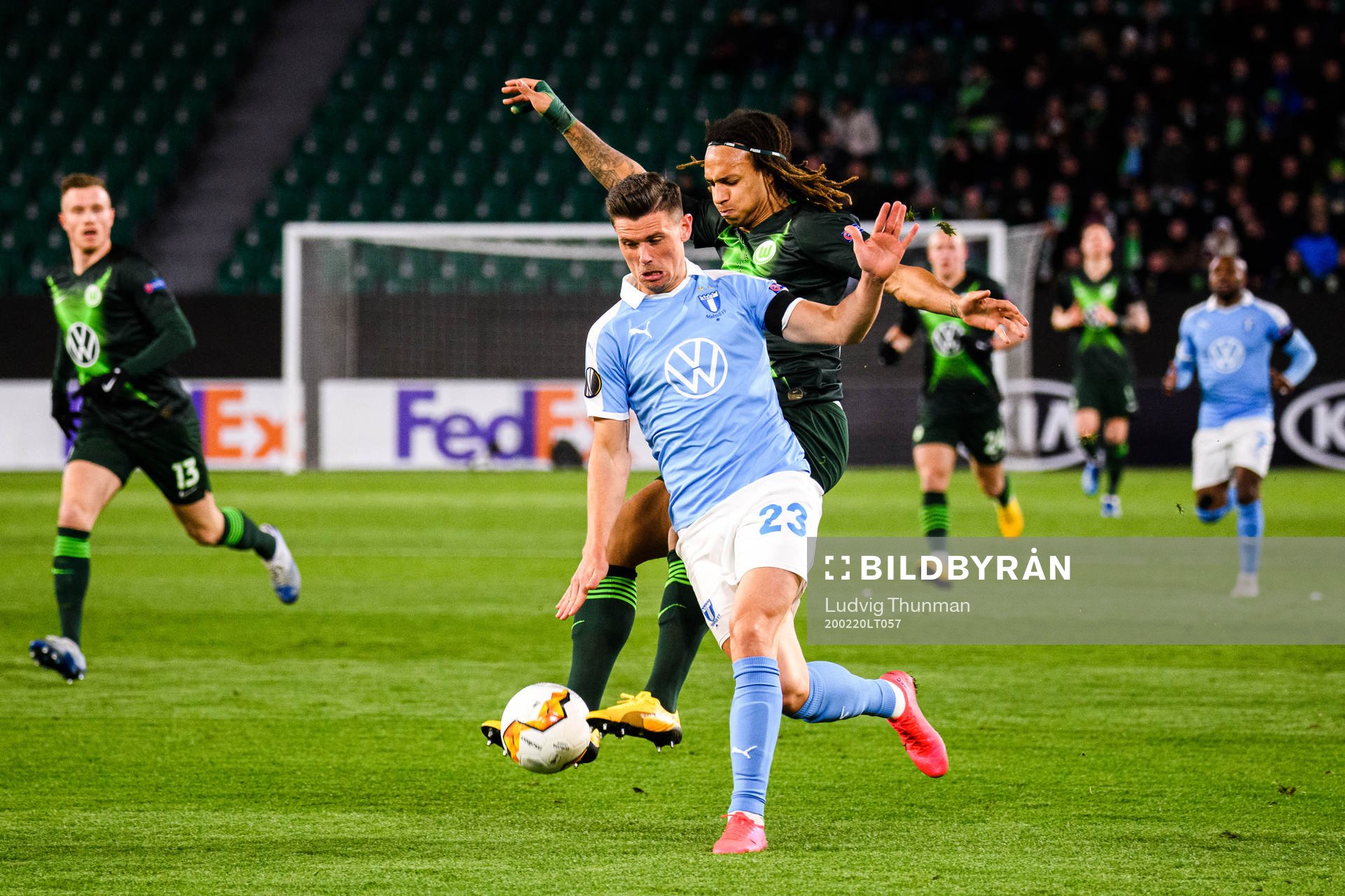 Marcus Antonsson of Malmö FF and Kevin Mbabu of Wolfsburg