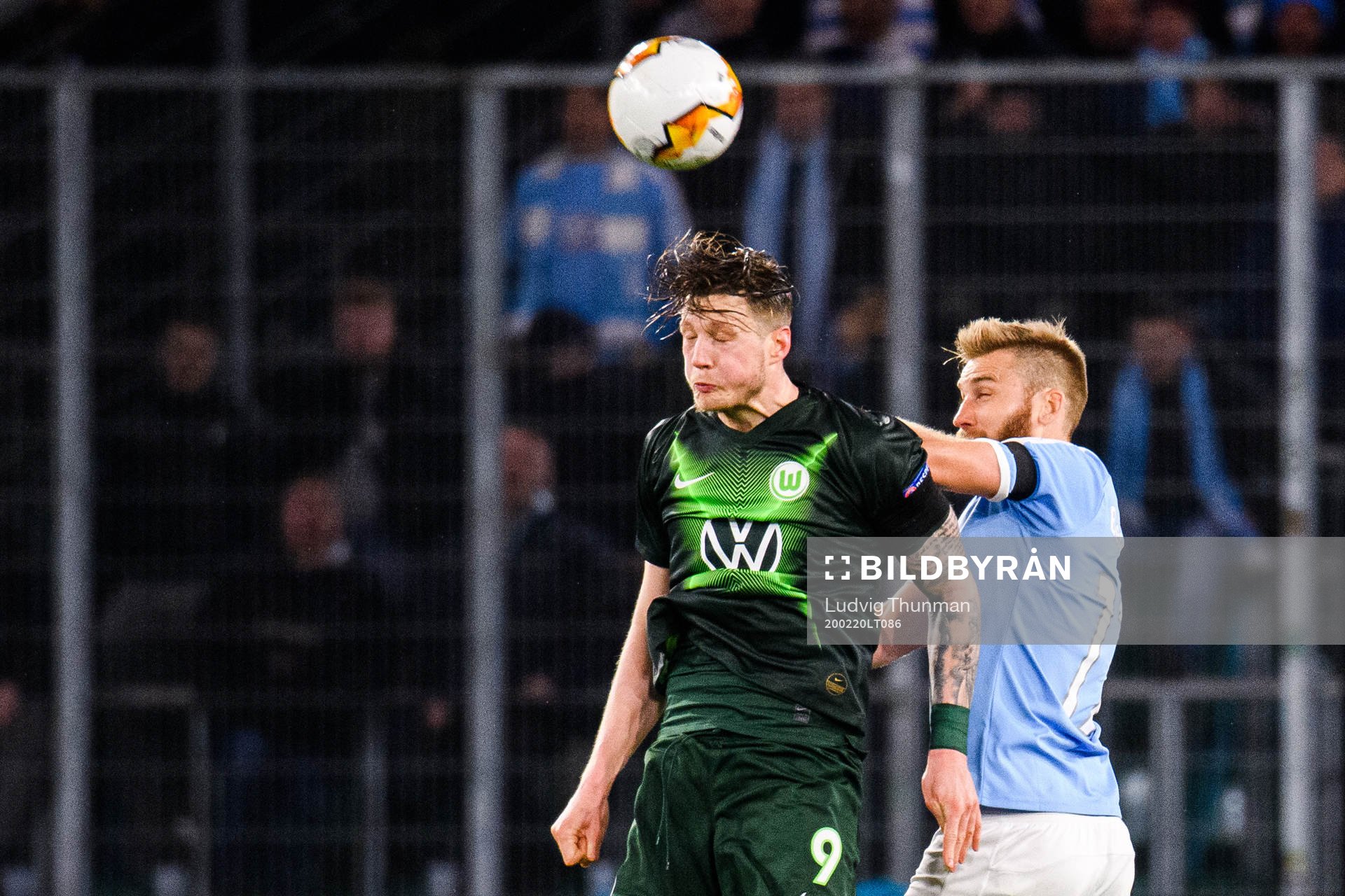 Wout Weghorst of Wolfsburg and Rasmus Bengtsson of Malmö FF during the Europa League round of 32 match between Wolfsburg and Malmö FF on February 20, 2020 in Wolfsburg.