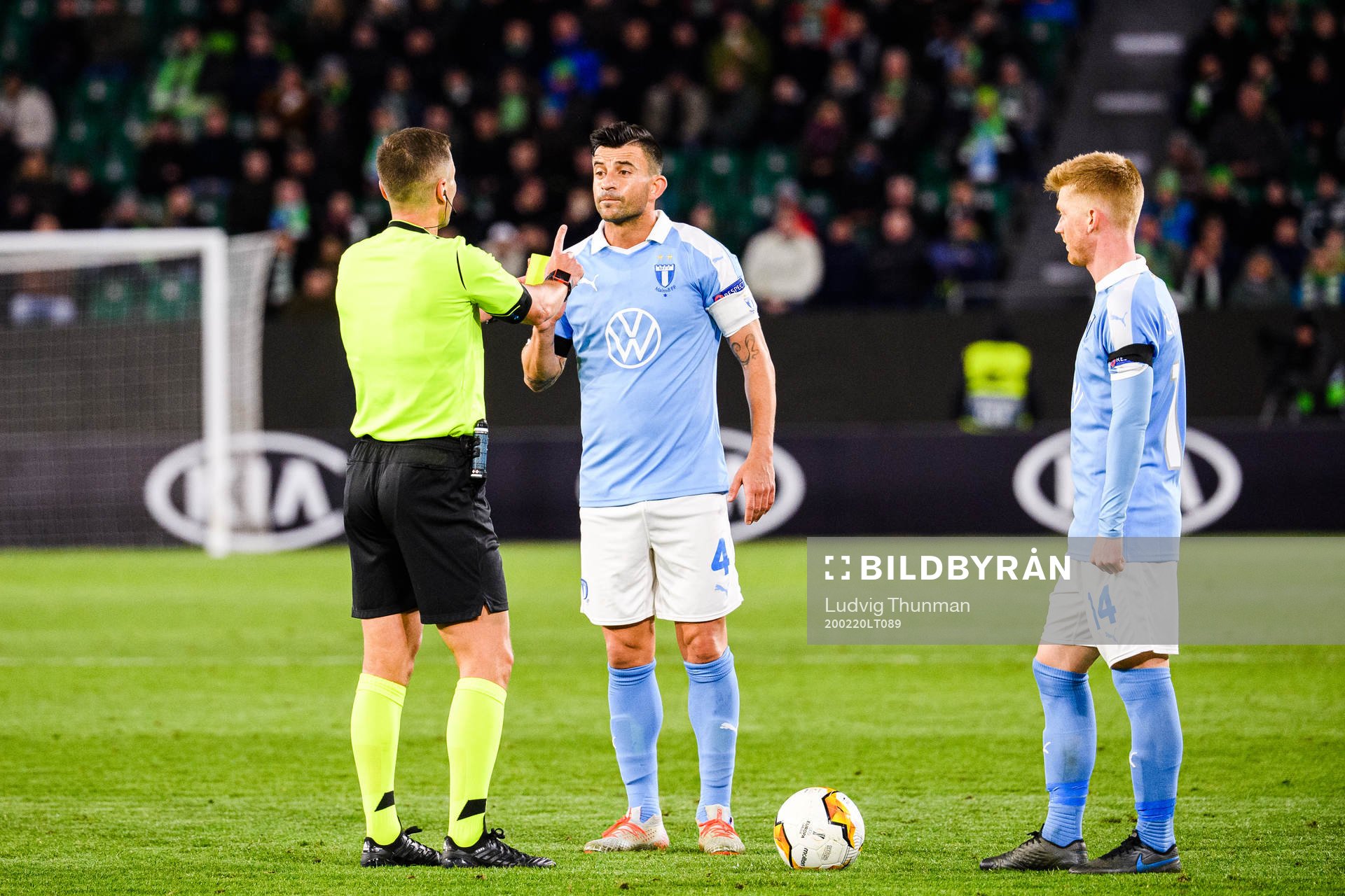 Behrang Safari of Malmö FF receives a yellow card