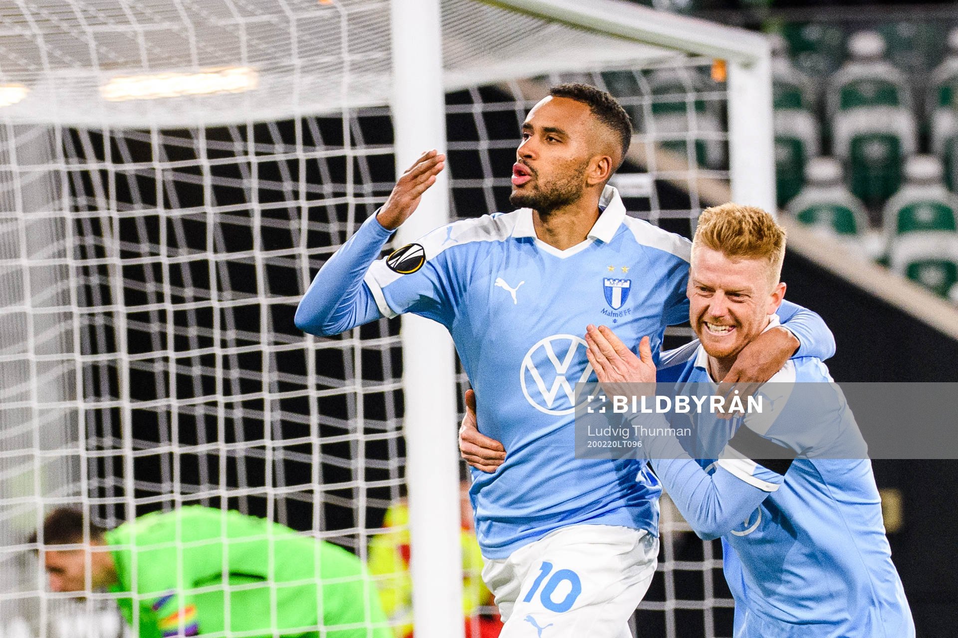 Isaac Kiese Thelin and Anders Christiansen of Malmö FF celebrate the 0-1 goal during the Europa League round of 32 match between Wolfsburg and Malmö FF on February 20, 2020 in Wolfsburg.
