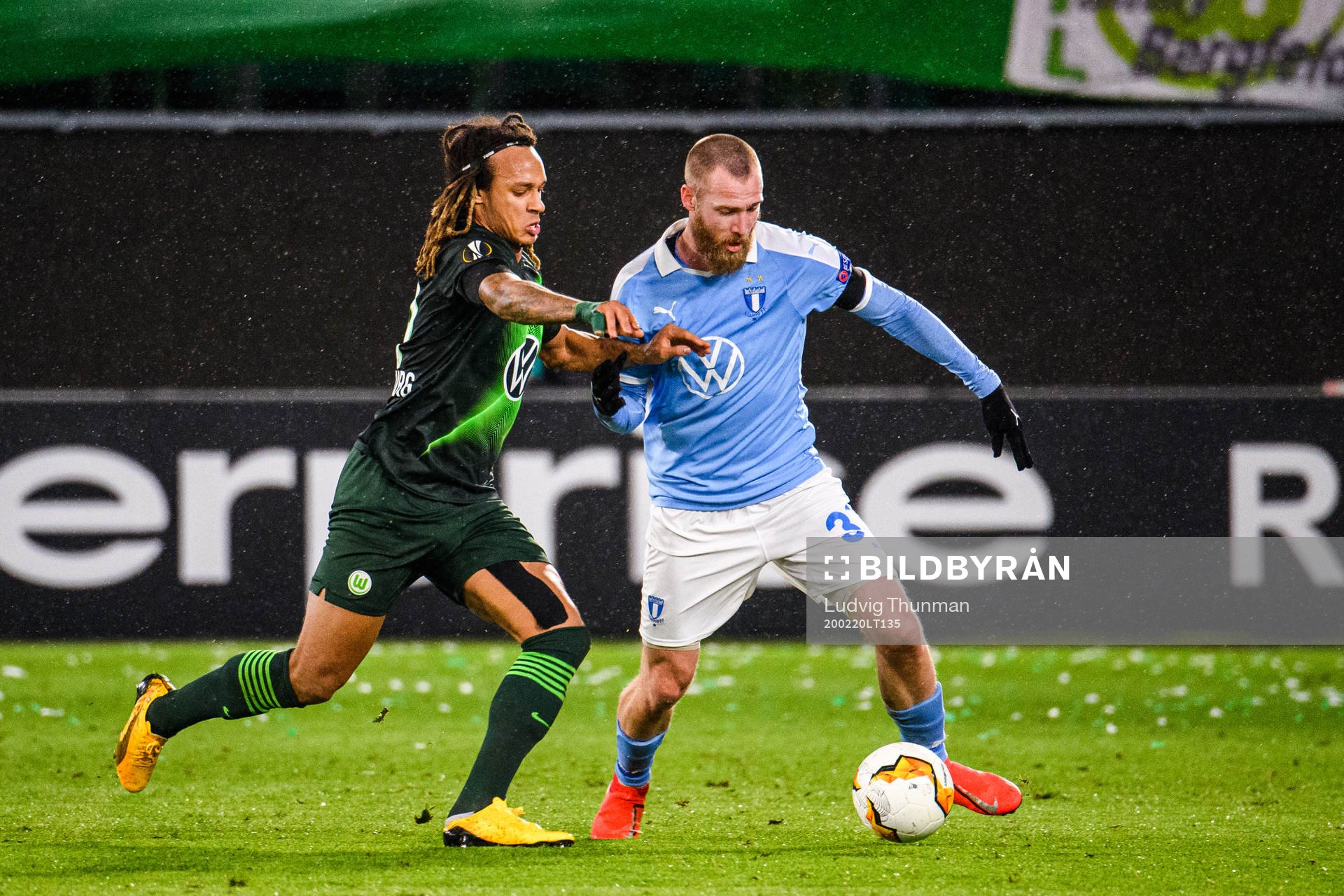 Kevin Mbabu of Wolfsburg and Jo Inge Berget of Malmö FF