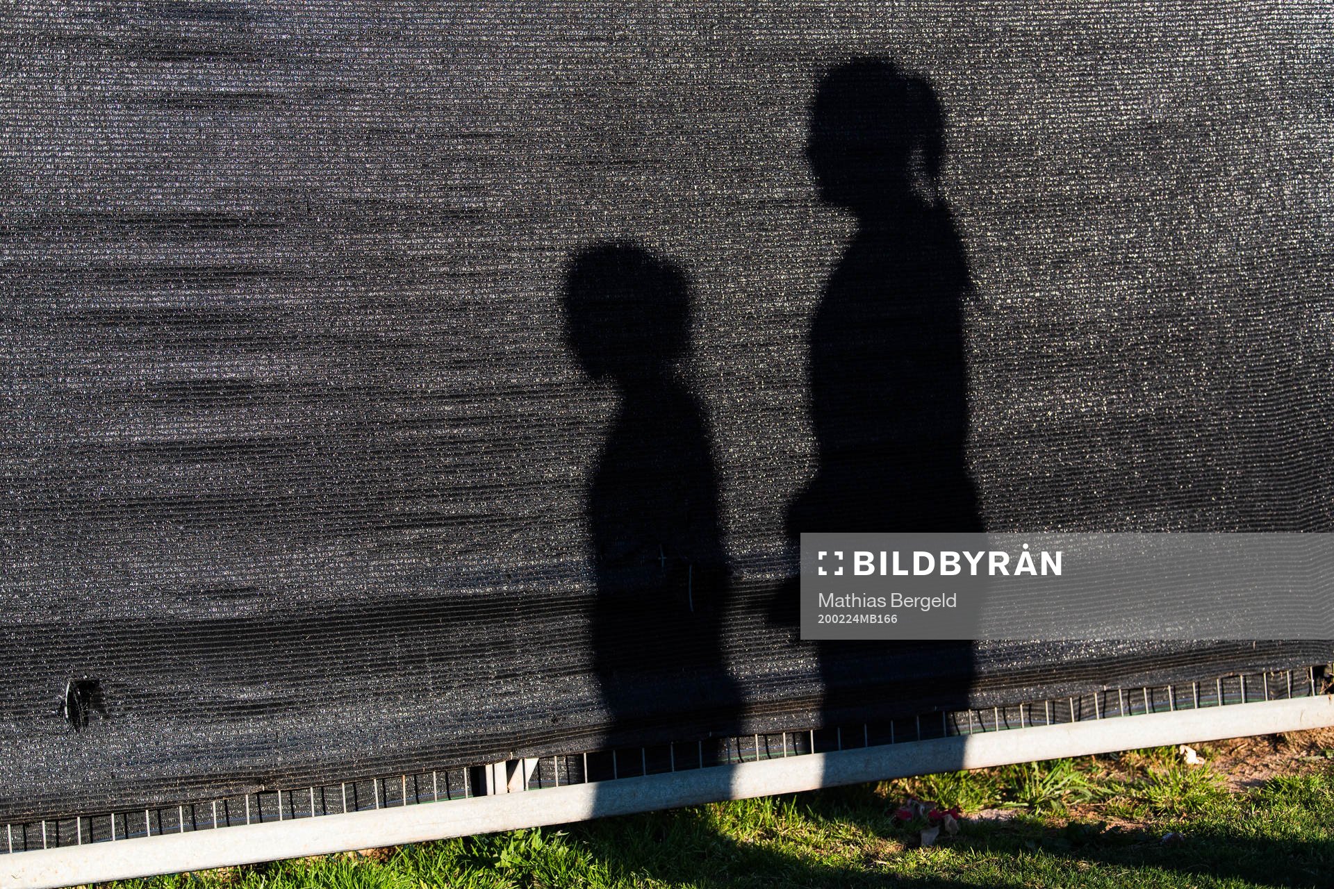 Shadows of players against a wall