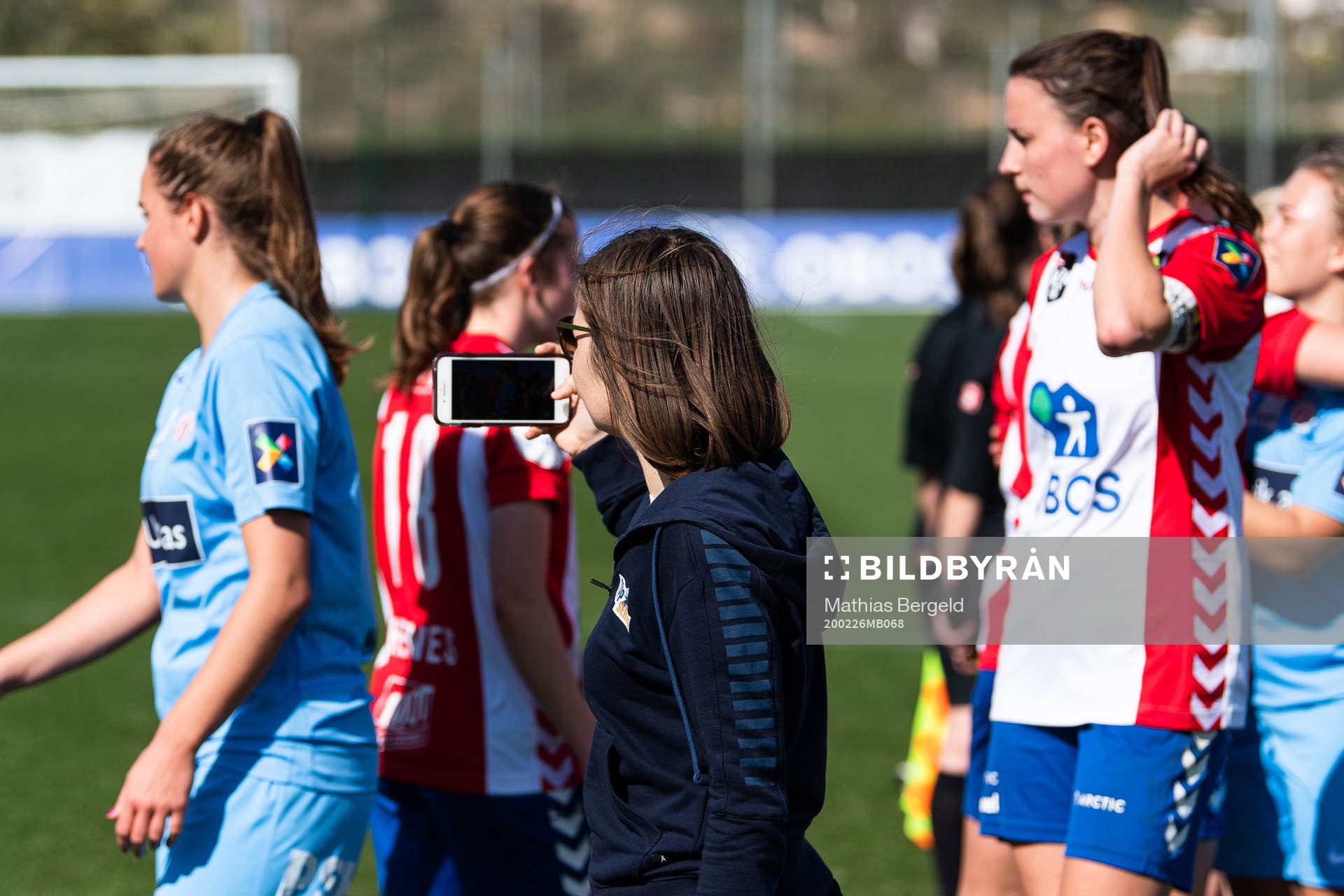 Michelle Le Gal Hermandsen, marketing manager at Toppfotball Kvinner, films after a pre-season friendly football match between Lyn and Avaldsnes on February 26, 2020 in La Manga.