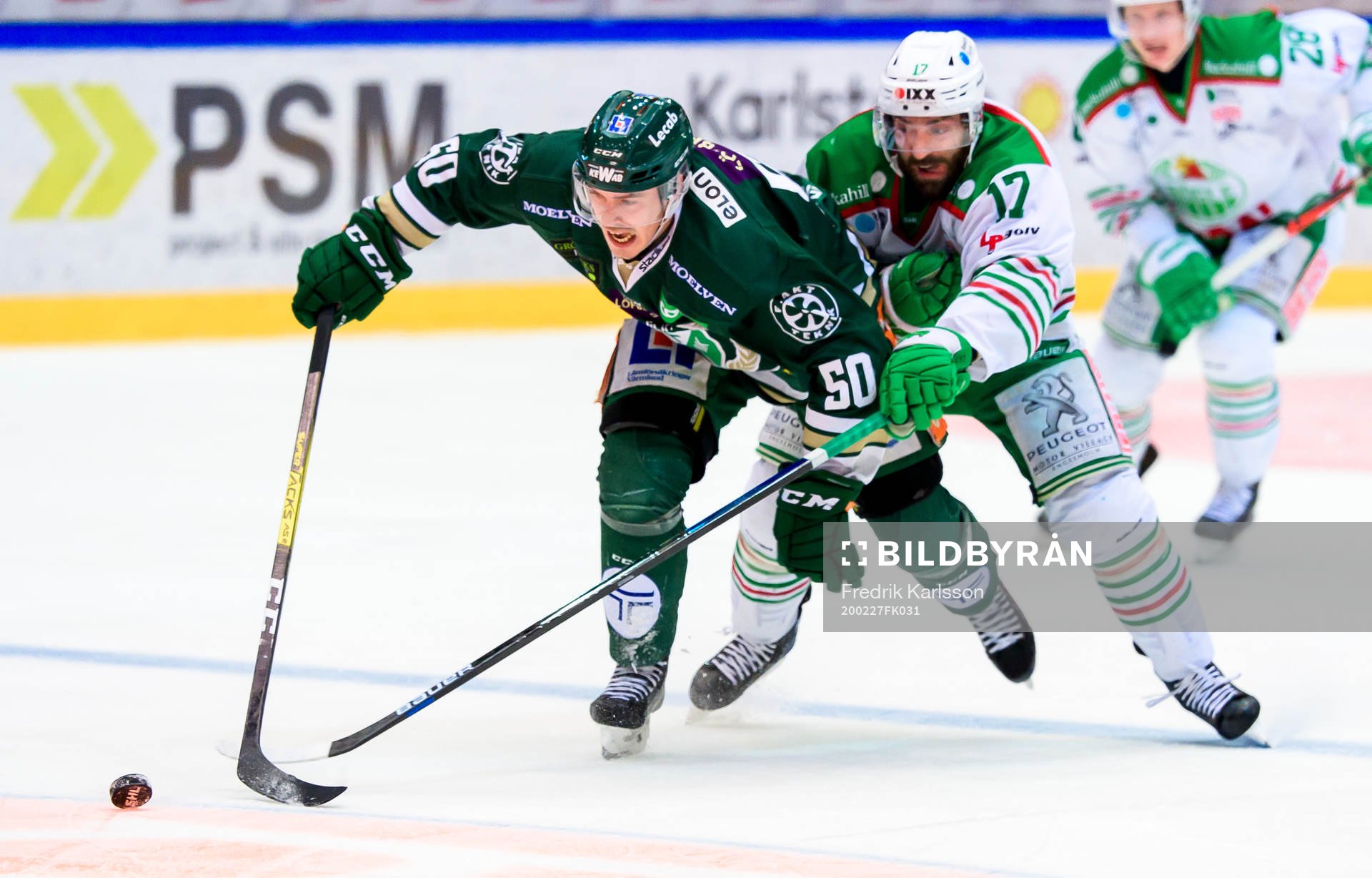 Färjestads Sebastian Erixon och Rögles Taylor Matson