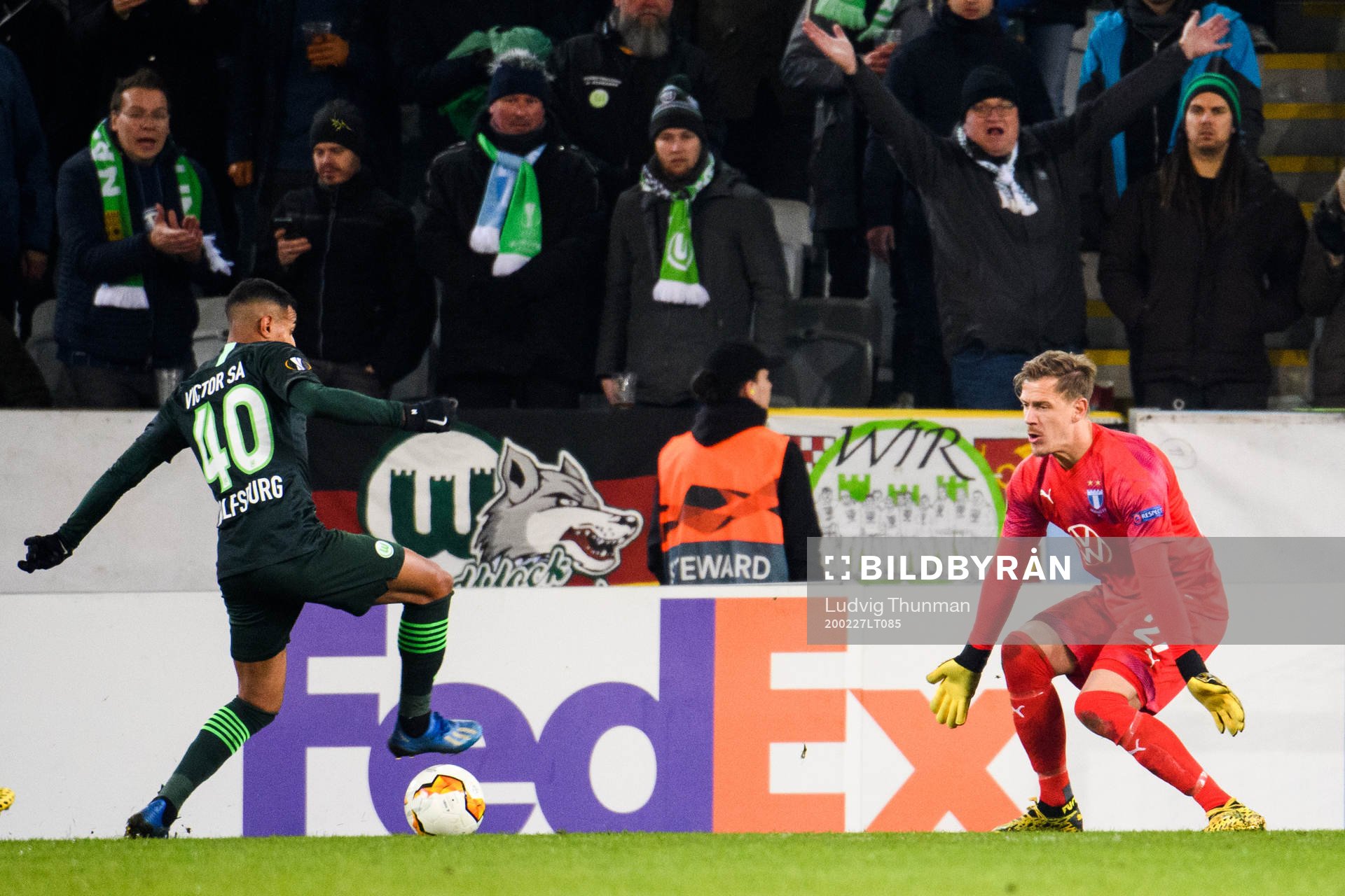 João Victor of Wolfsburg and goalkeeper Johan Dahlin of