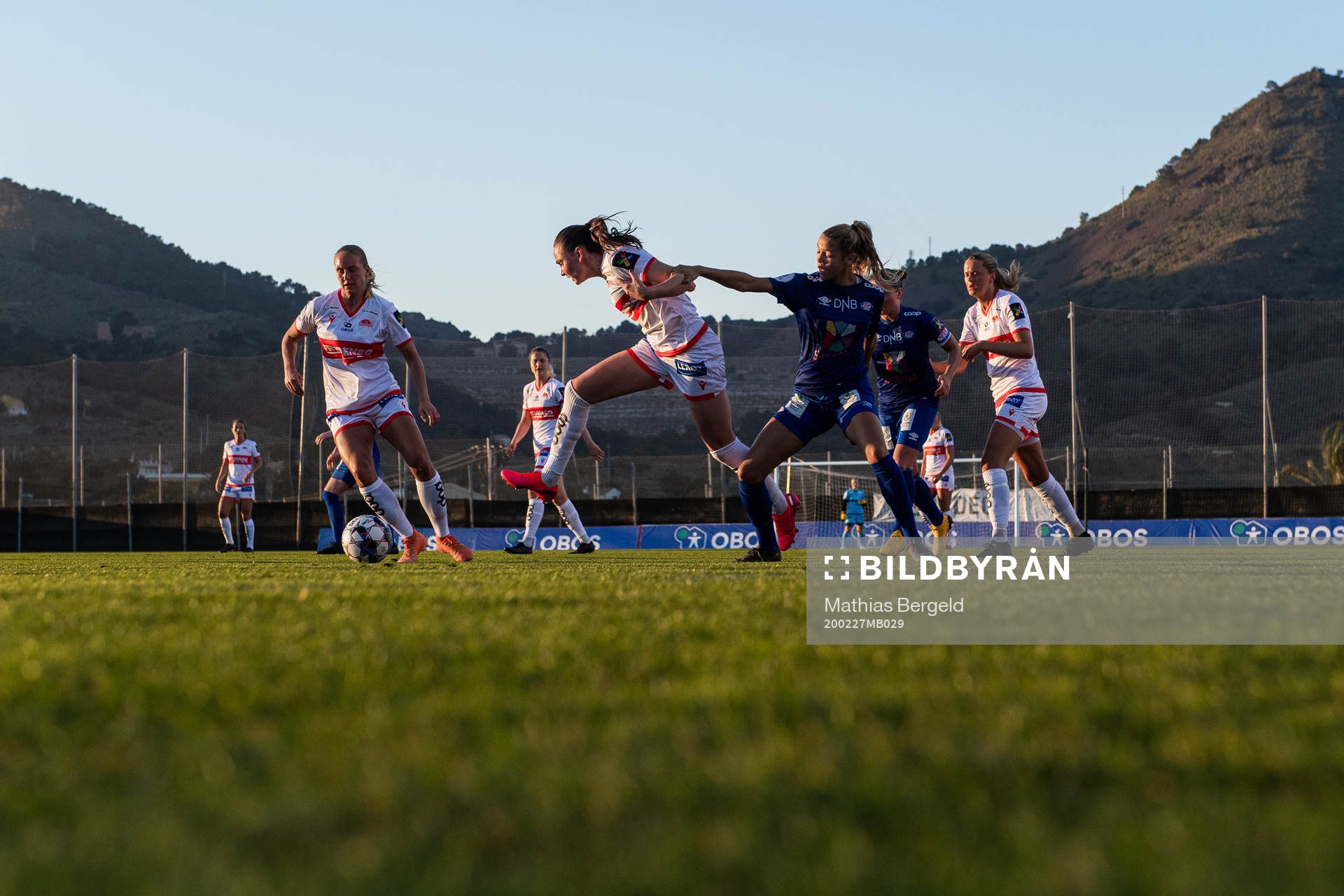 Vilde Hasund of Sandviken competes for the ball with Celin