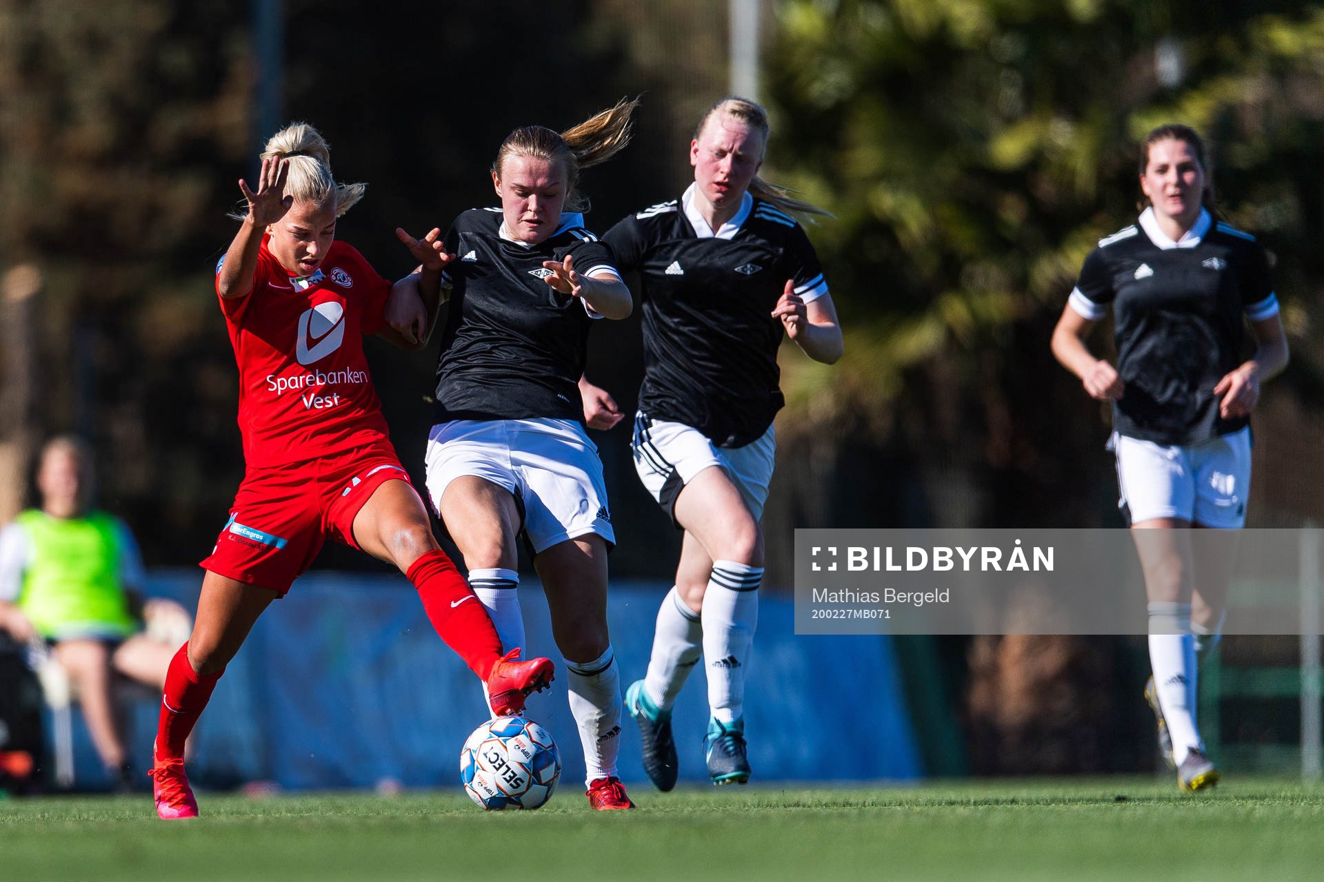 Rikke Nygard of Arna-Bjørnar competes for the ball with
