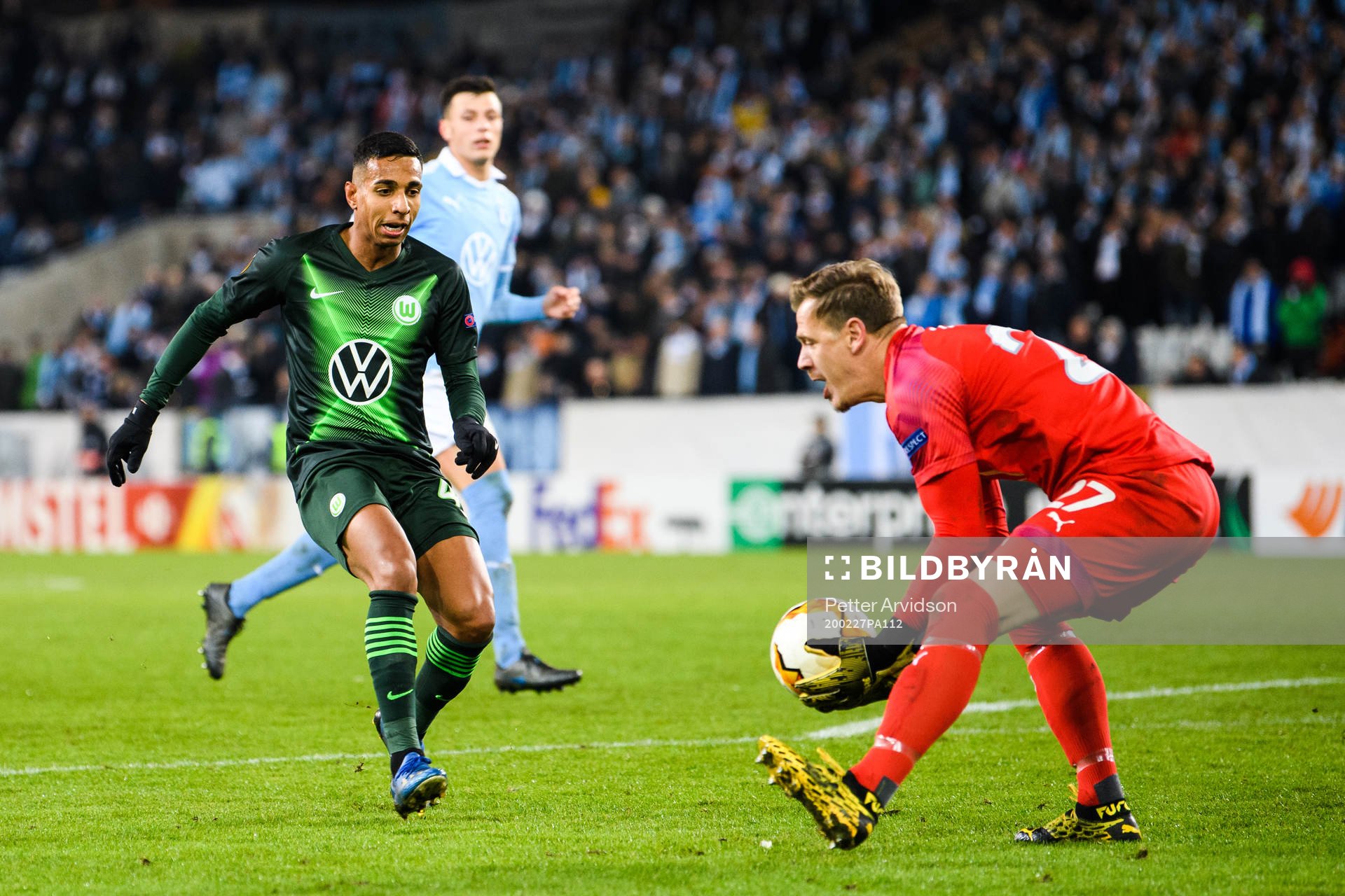 João Victor of Wolfsburg and goalkeeper Johan Dahlin of