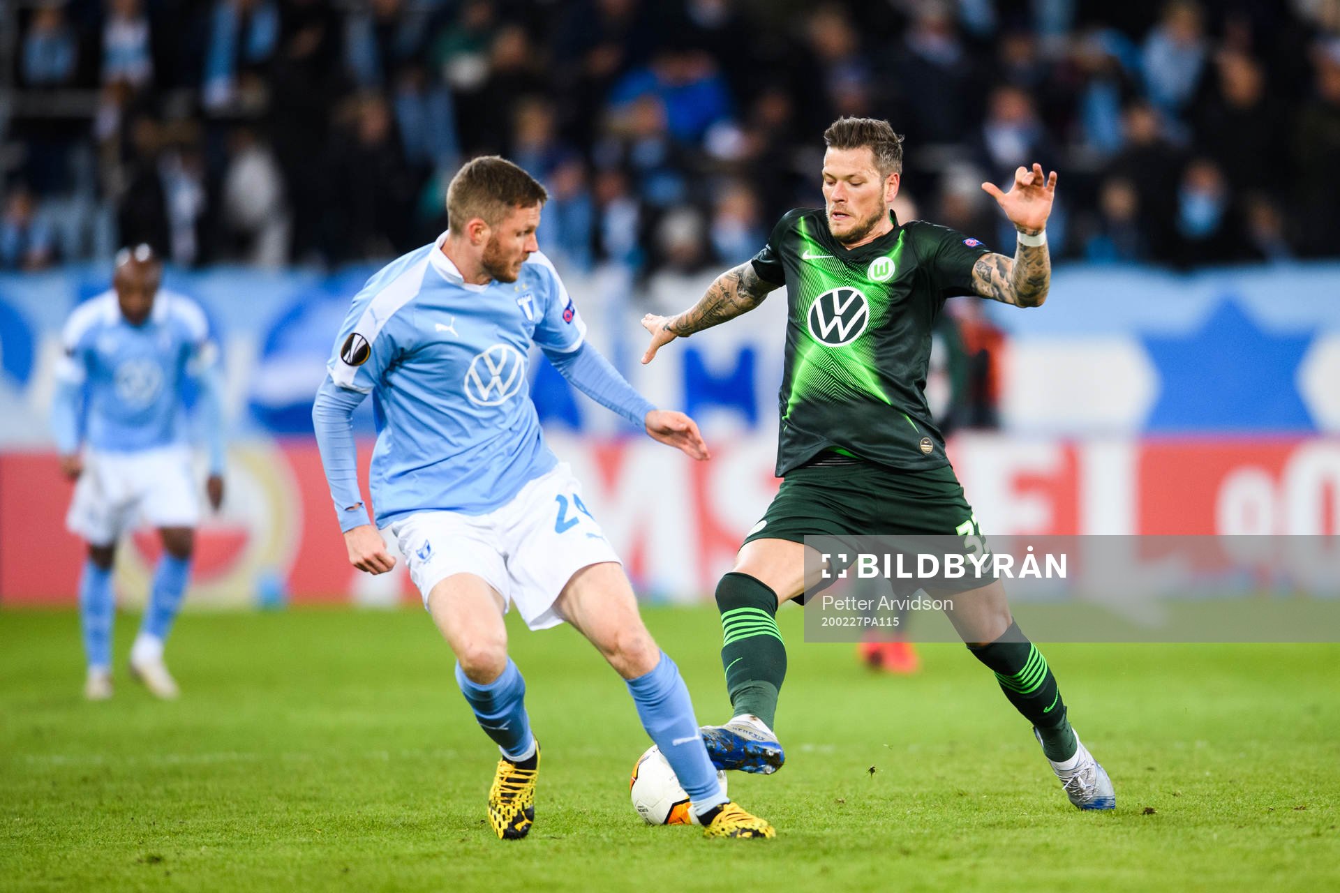 Daniel Ginczek of Wolfsburg and Lasse Nielsen of Malmö FF during of the Europa Leauge match between Malmö FF and Wolfsburg on February 27, 2020 in Malmö.
