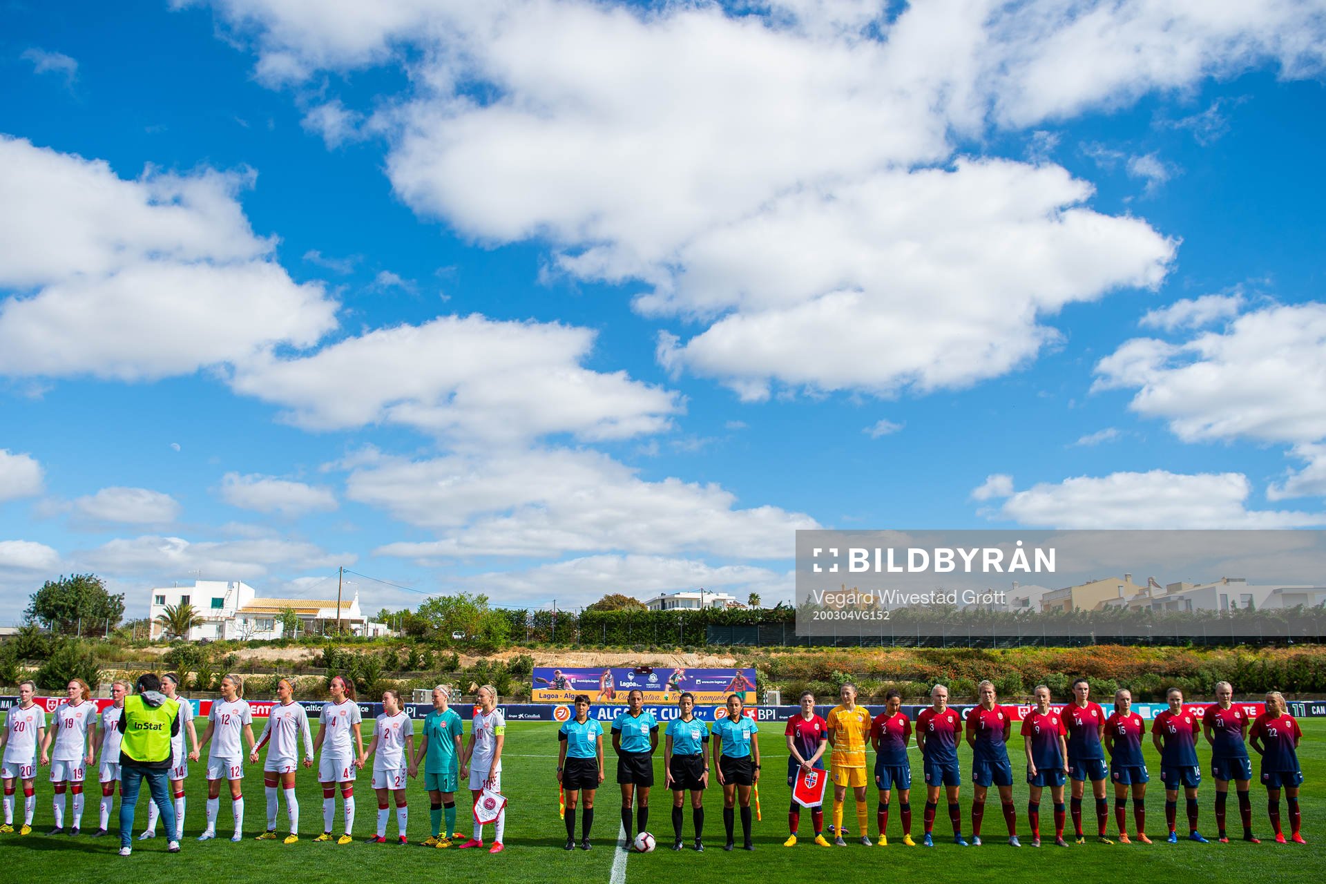 Players of Denmark and of Norway line up