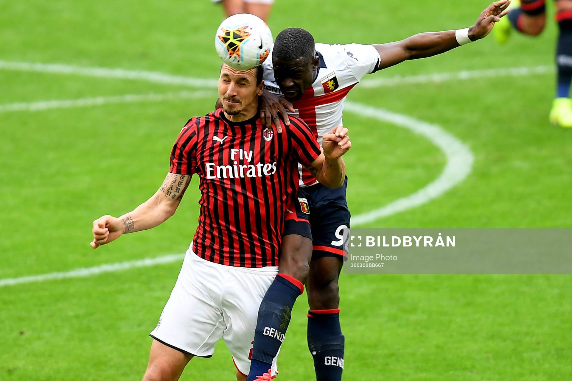 Zlatan Ibrahimovic of Milan and Adama Soumaoro of Genoa