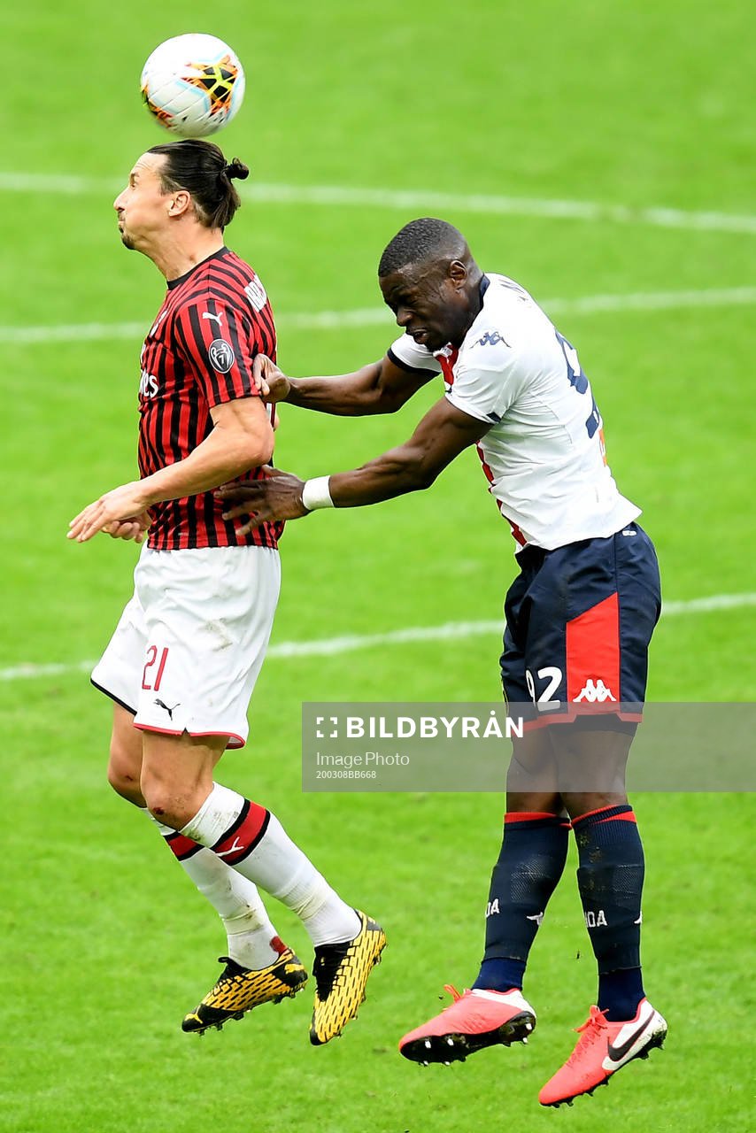 Zlatan Ibrahimovic of Milan and Adama Soumaoro of Genoa