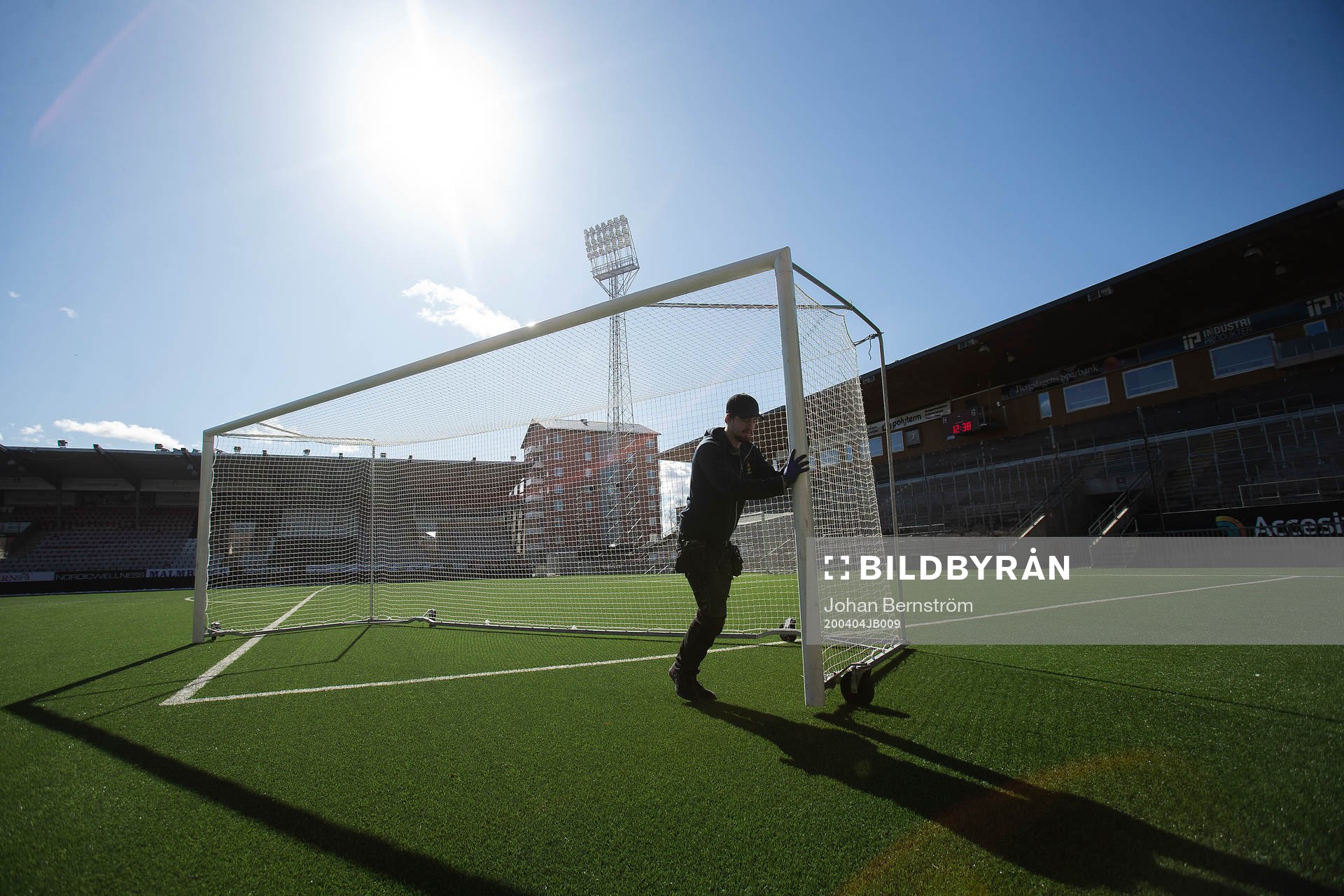 A caretaker is moving a goal at Behrn Arena as the