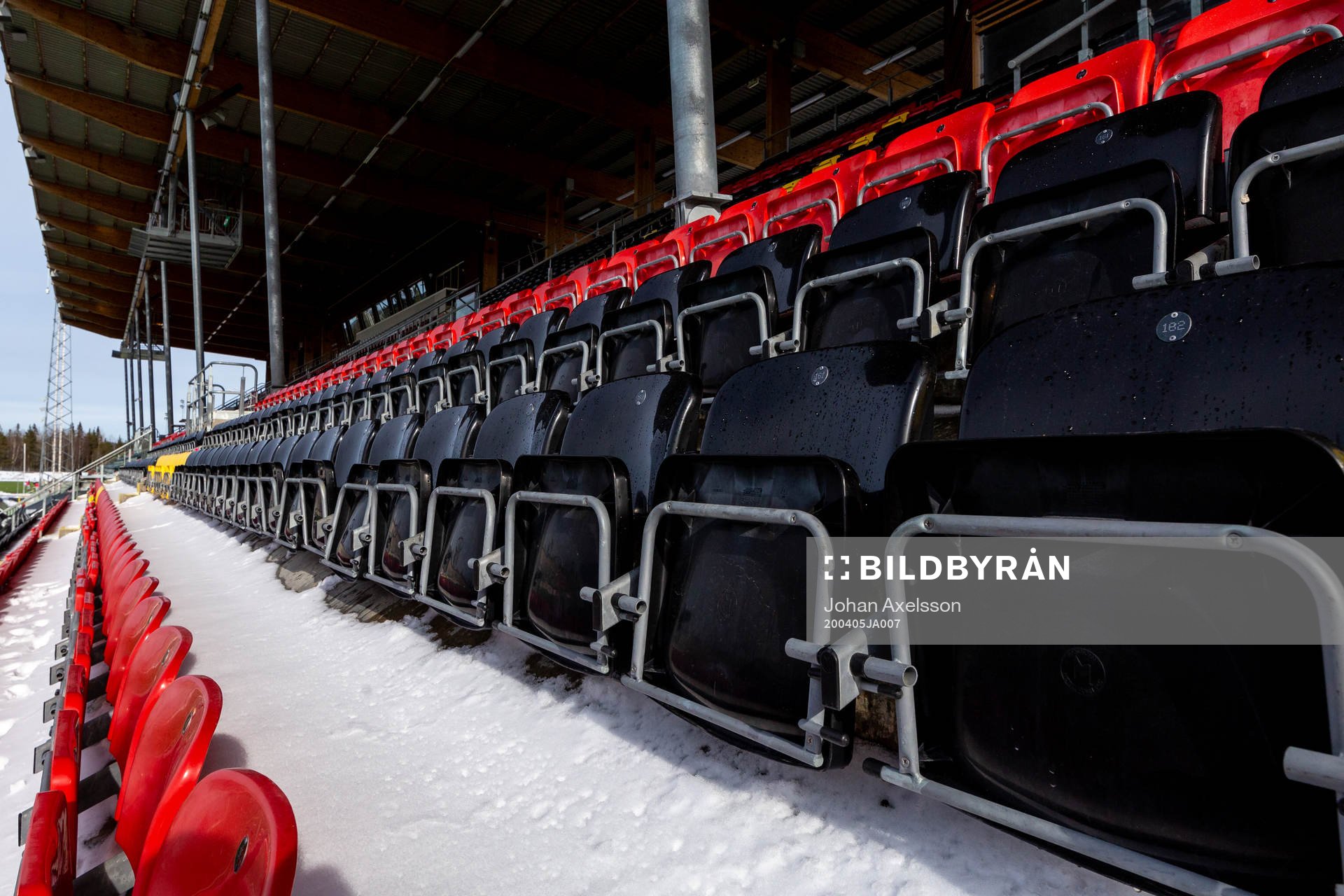 Spectator seats in snow at Jämtkraft Arena as the