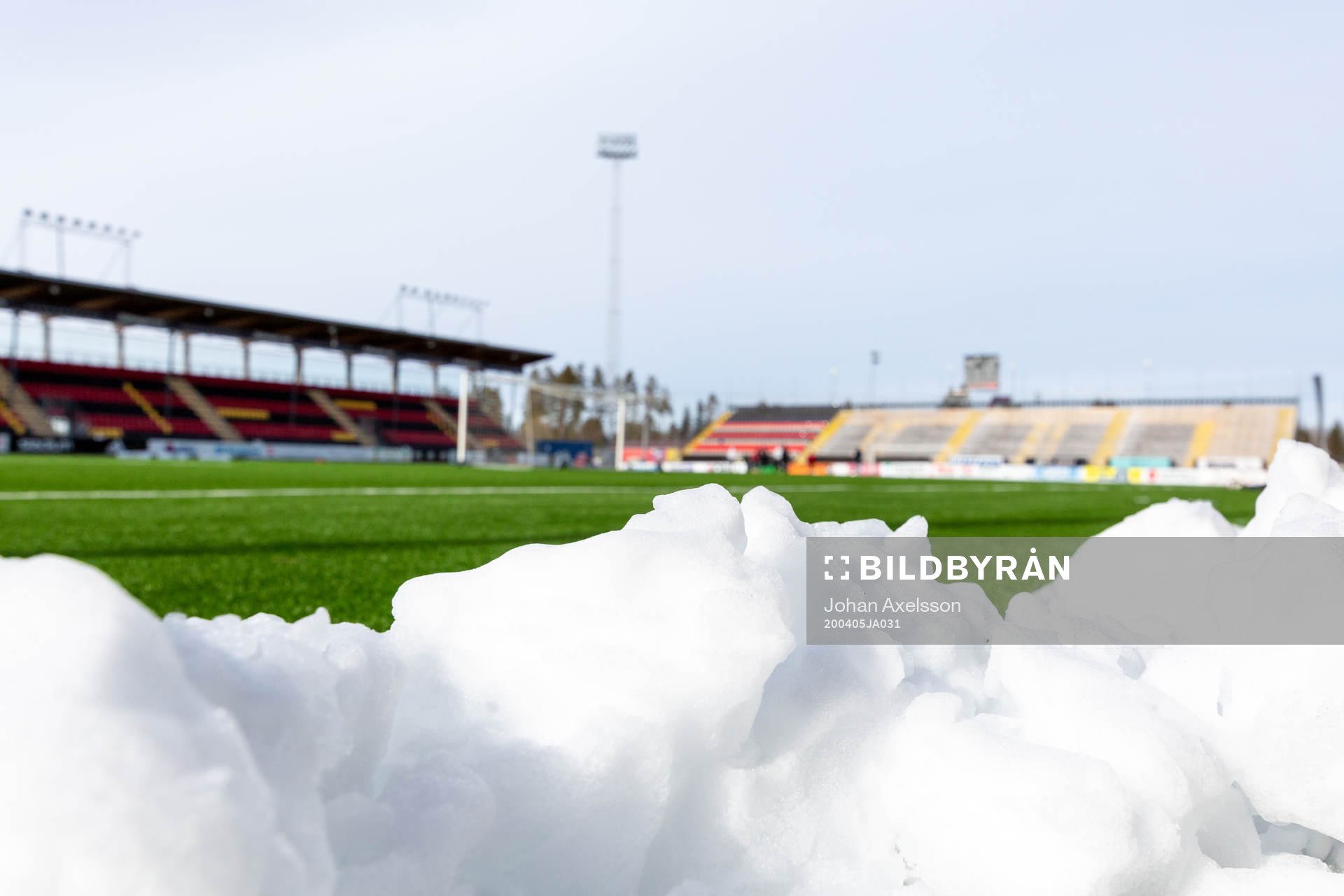 Snow piled up in front of the pitch at Jämtkraft Arena as