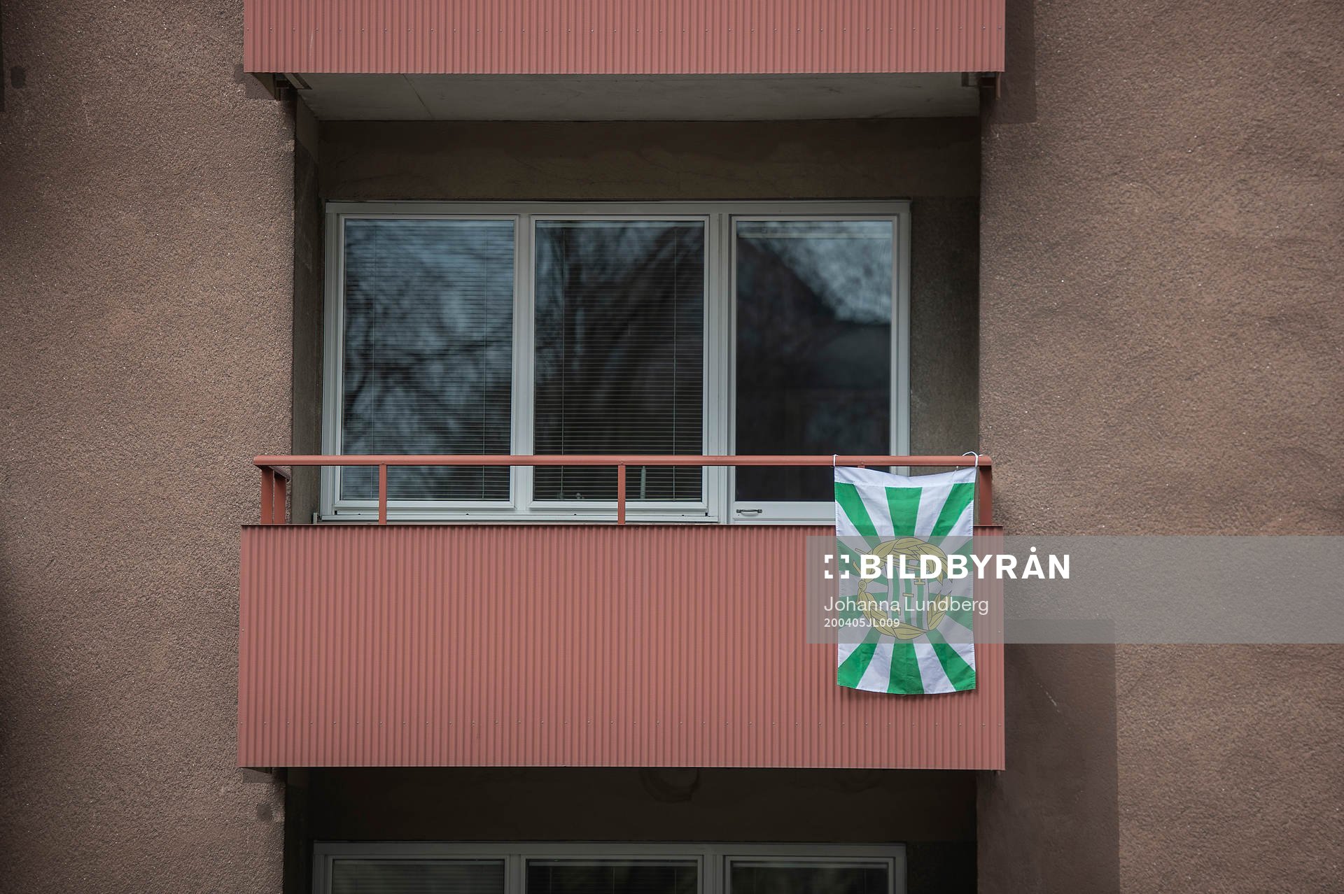A balcony near Tele2 Arena is decorated with a flag to show