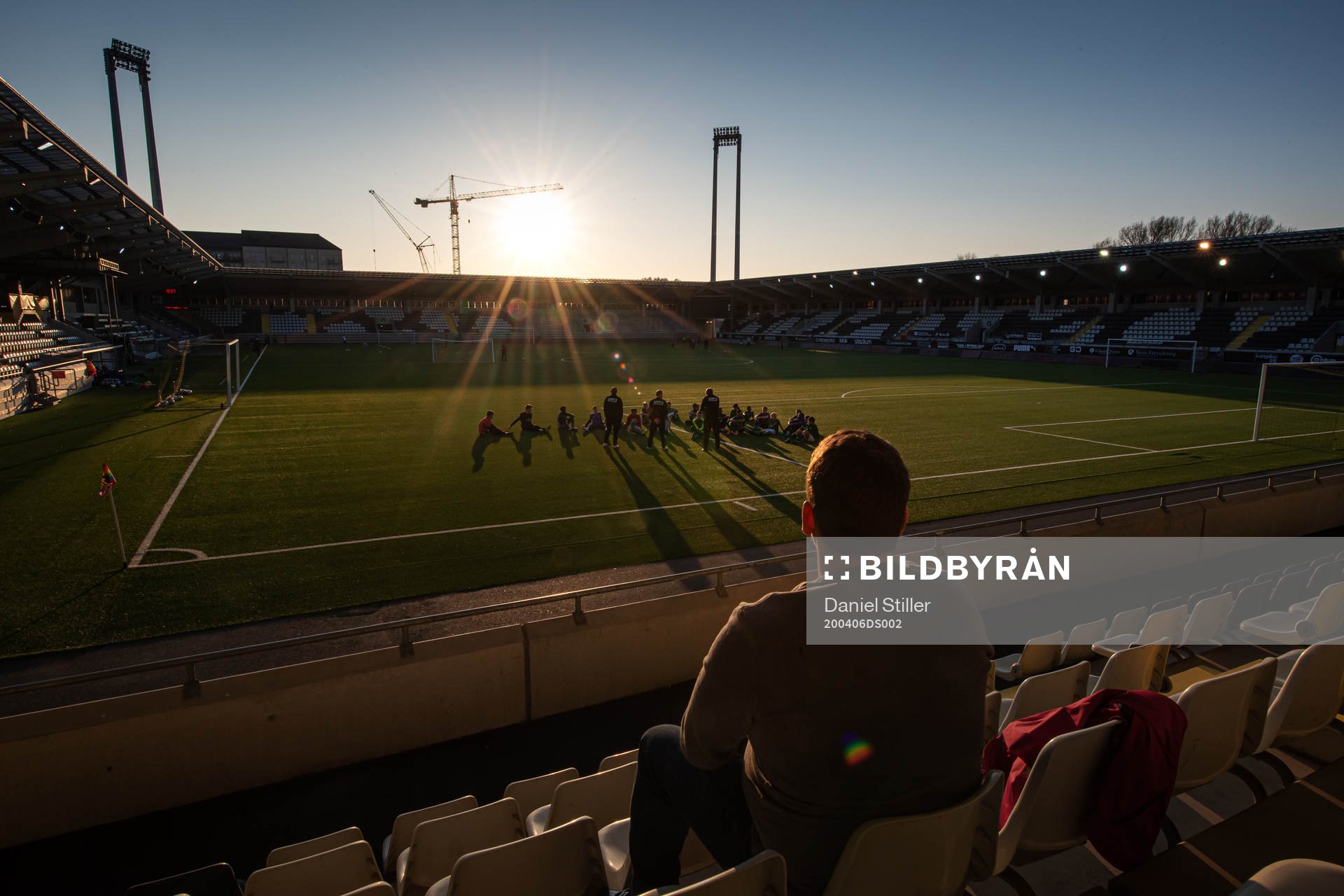 A father watches his son’s football practice at Bravida