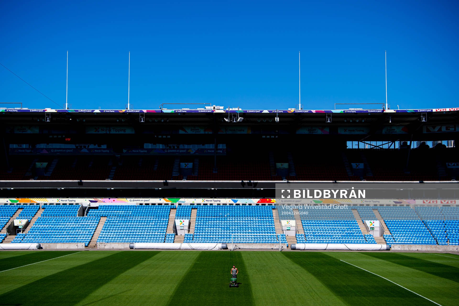 A groundsman maintains the pitch