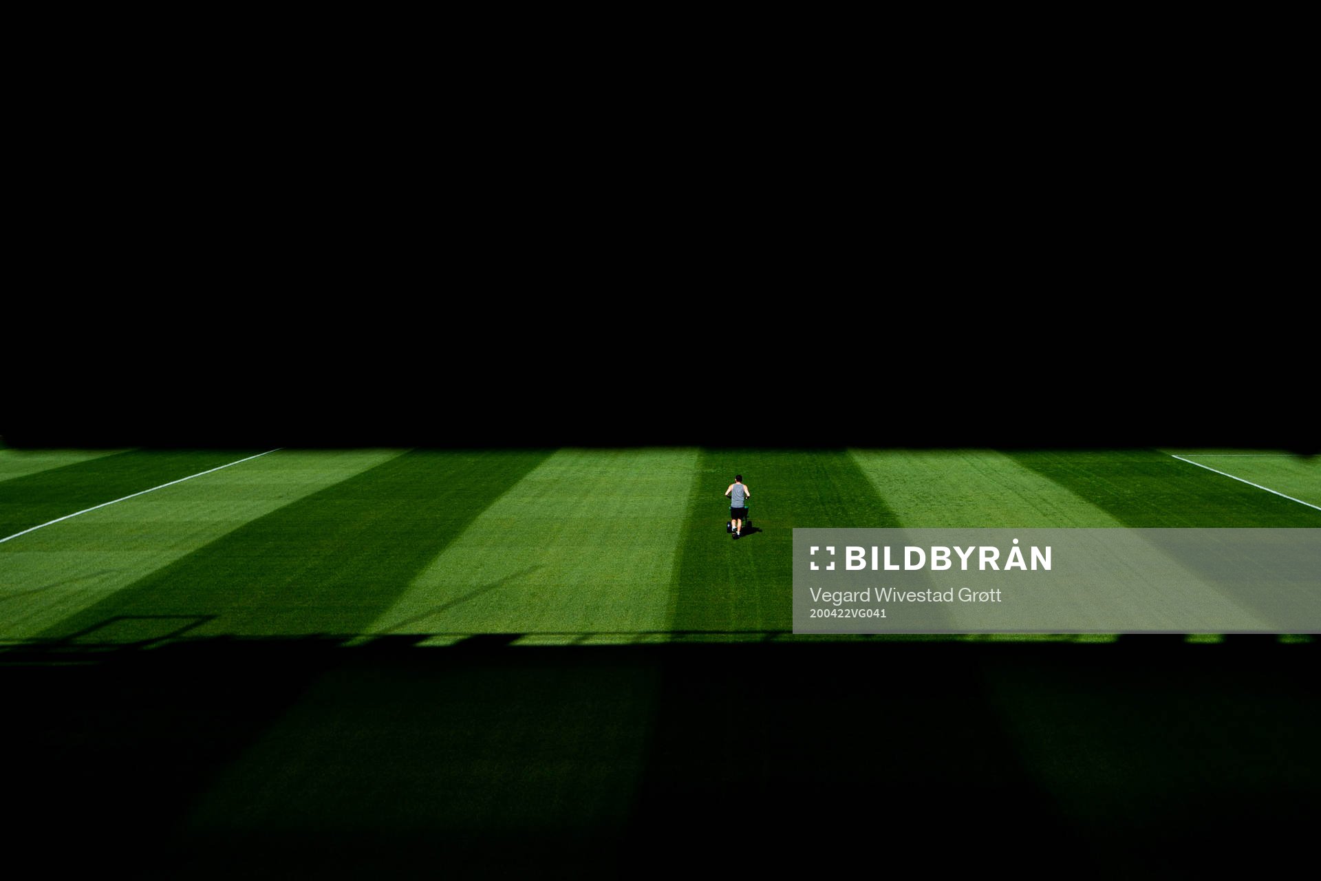 A groundsman maintains the pitch
