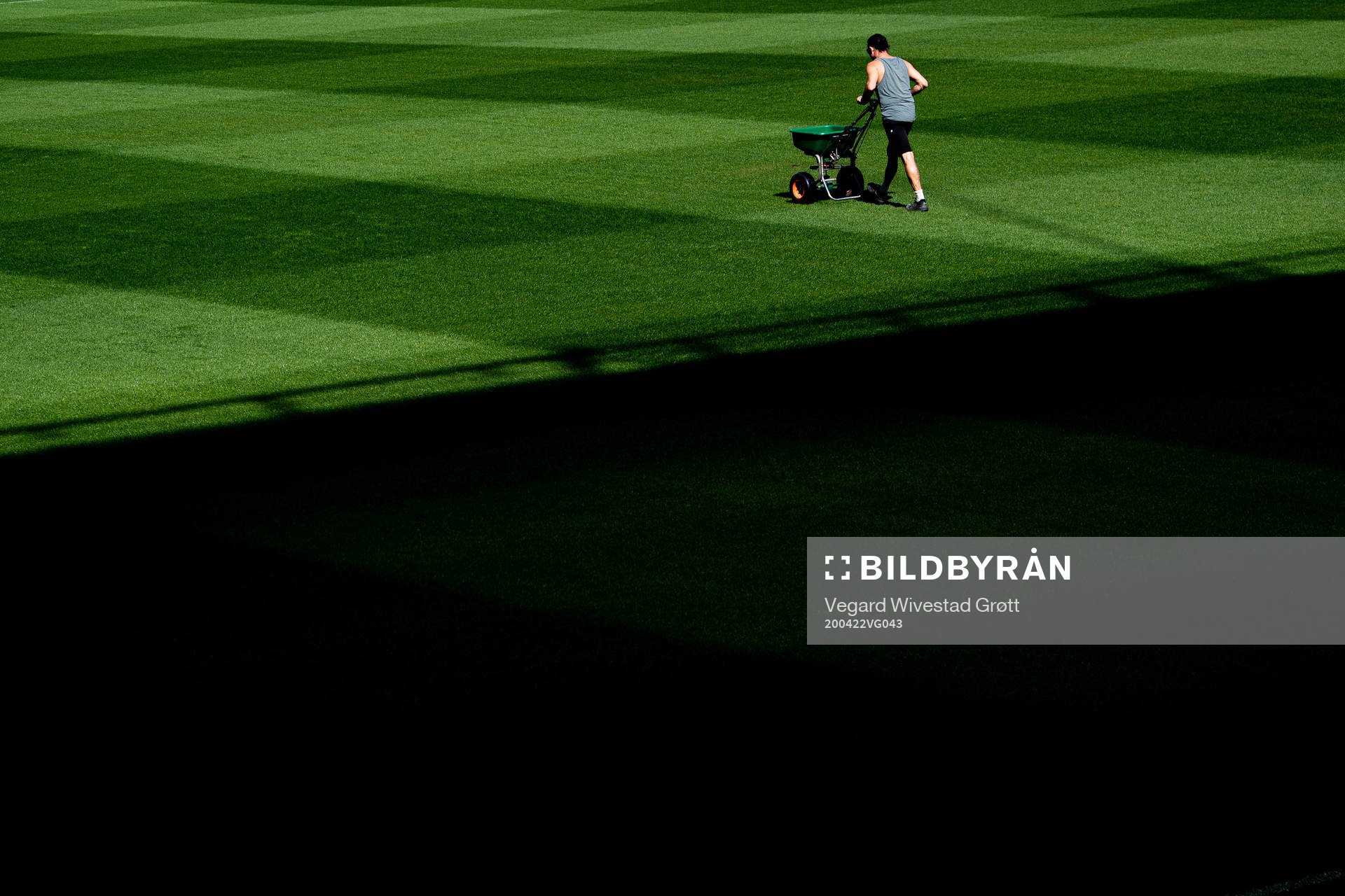 A groundsman maintains the pitch