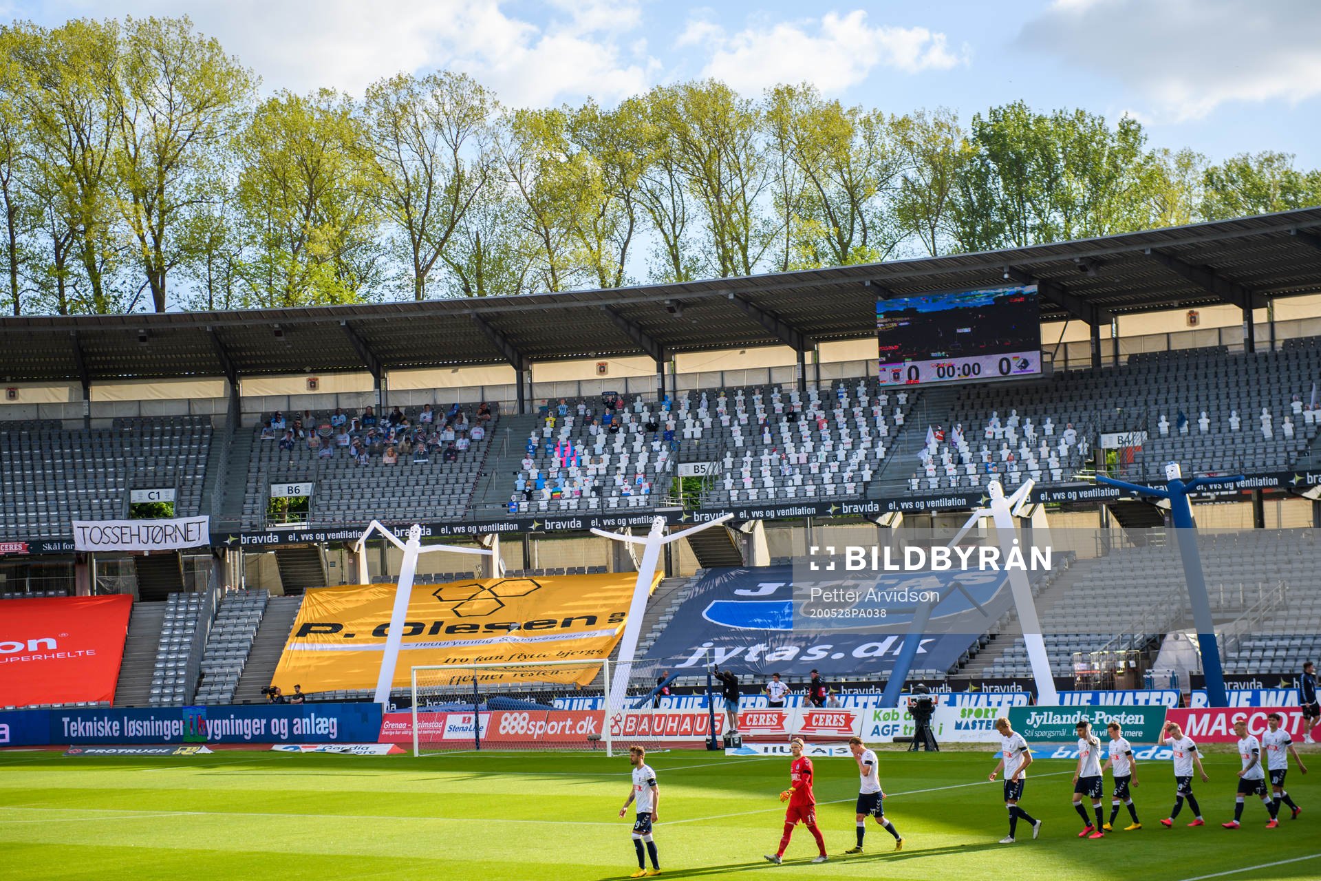 Paper dolls in the stands as players of Aarhus enter the