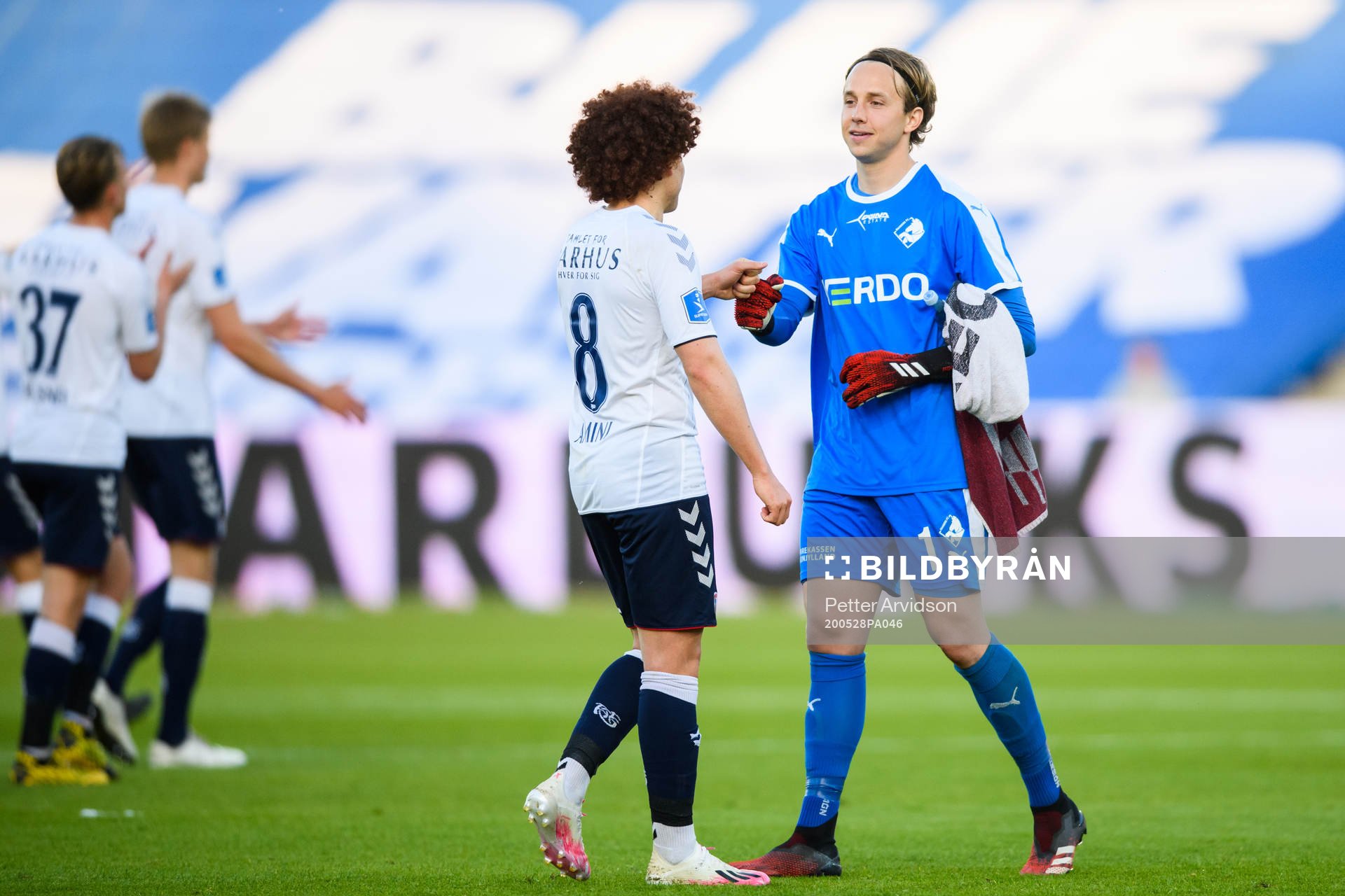 Goalkeeper Patrik Carlgren of Randers and Mustafa Amini of Aarhus after the Danish Superliga match between AGF Aarhus and Randers FC which are played without spectators due to the coronavirus covid-19, on May 28, 2020 in Aarhus.