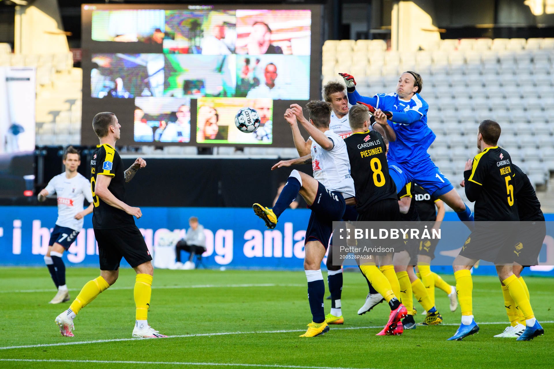 Goalkeeper Patrik Carlgren of Randers in action infront of a virtual grandstand with supporters during the Danish Superliga match between AGF Aarhus and Randers FC which are played without spectators due to the coronavirus covid-19, on May 28, 2020 in Aarhus.