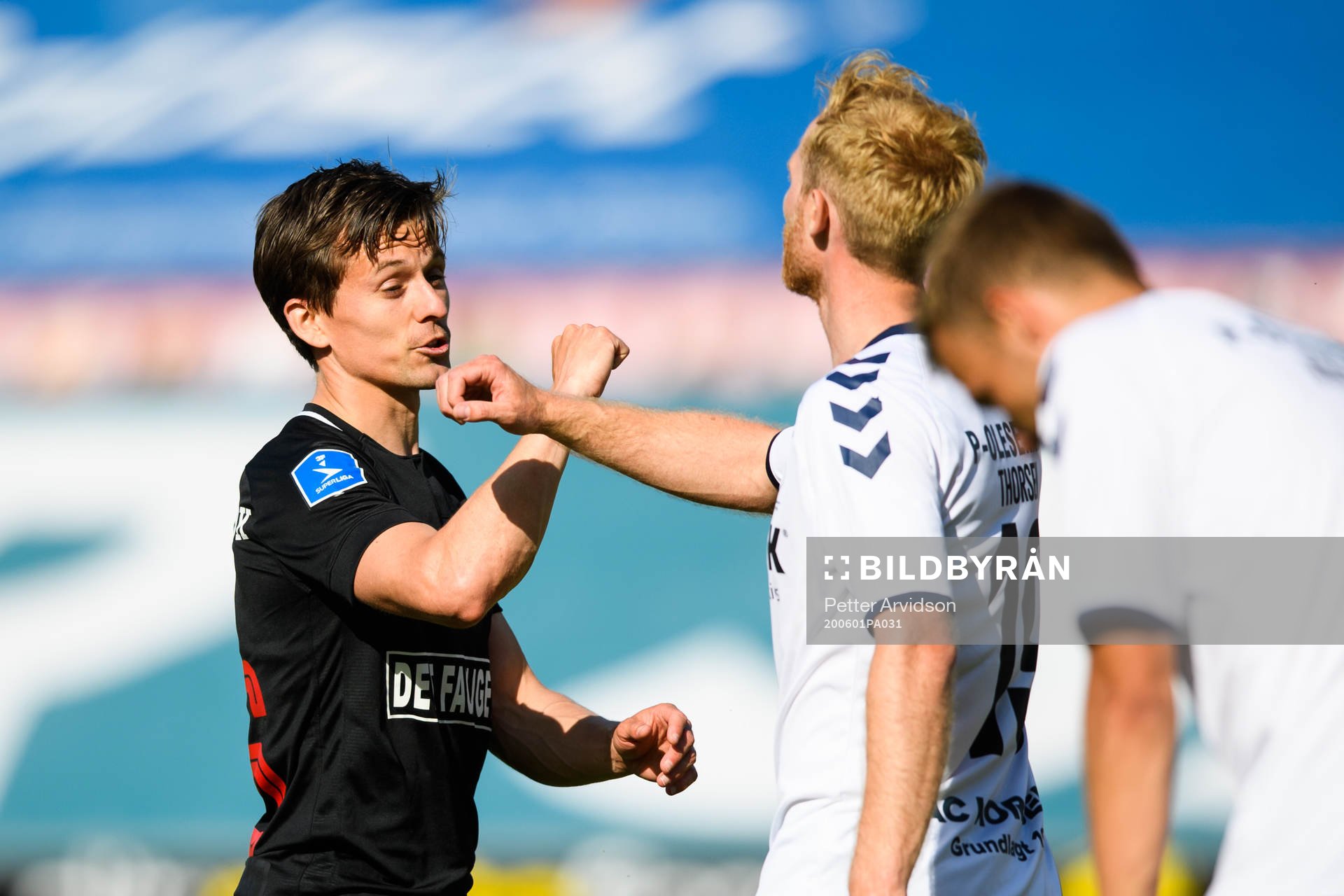 Lasse Vibe of Midtjylland and Jonas Thorsen of Horsens after the Danish Superliga match between FC Midtjylland and AC Horsens on July 1, 2020 in Herning.