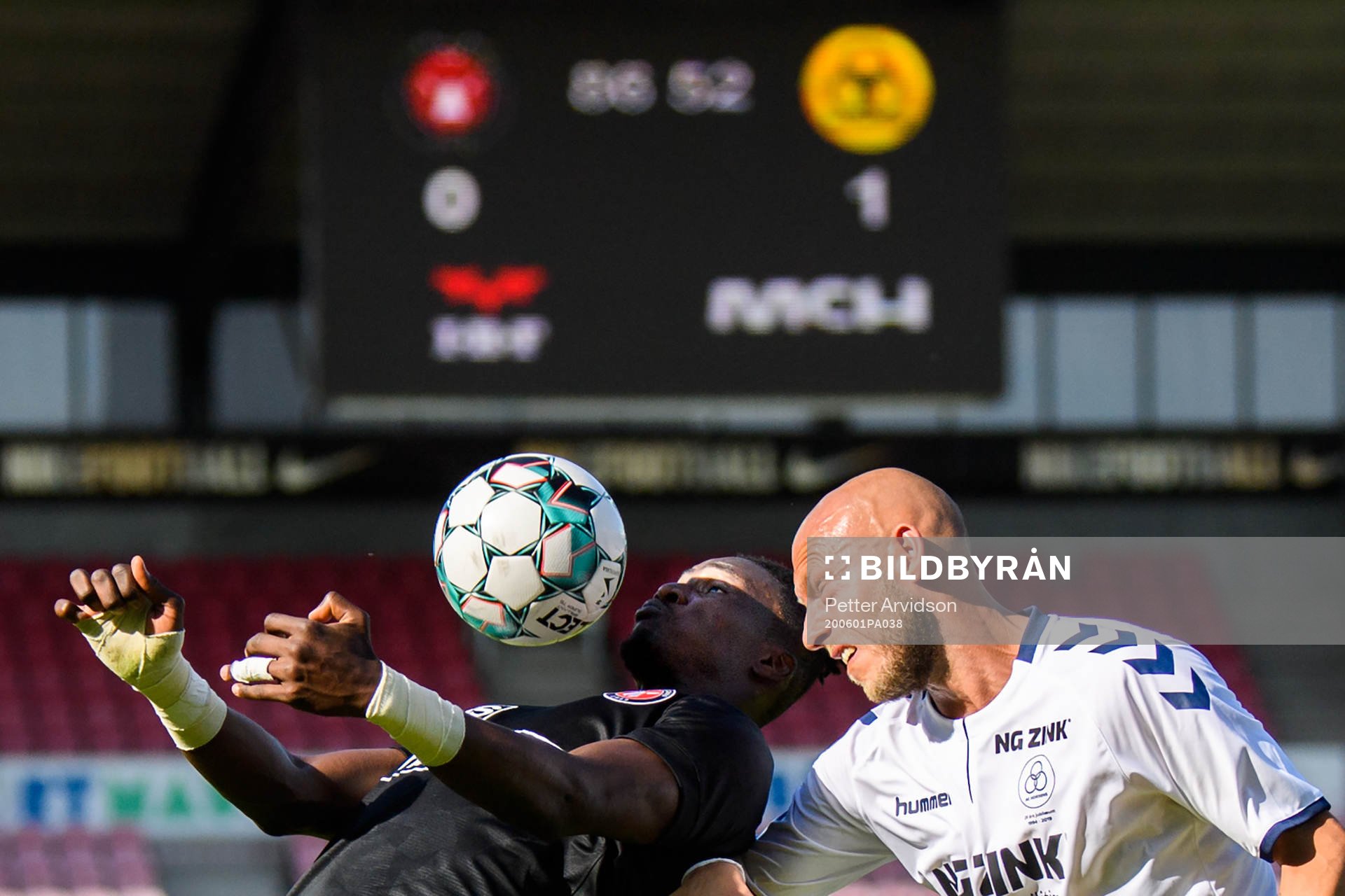 Sory Kaba of Midtjylland and Michael Lump of Horsens during the Danish Superliga match between FC Midtjylland and AC Horsens on July 1, 2020 in Herning.
