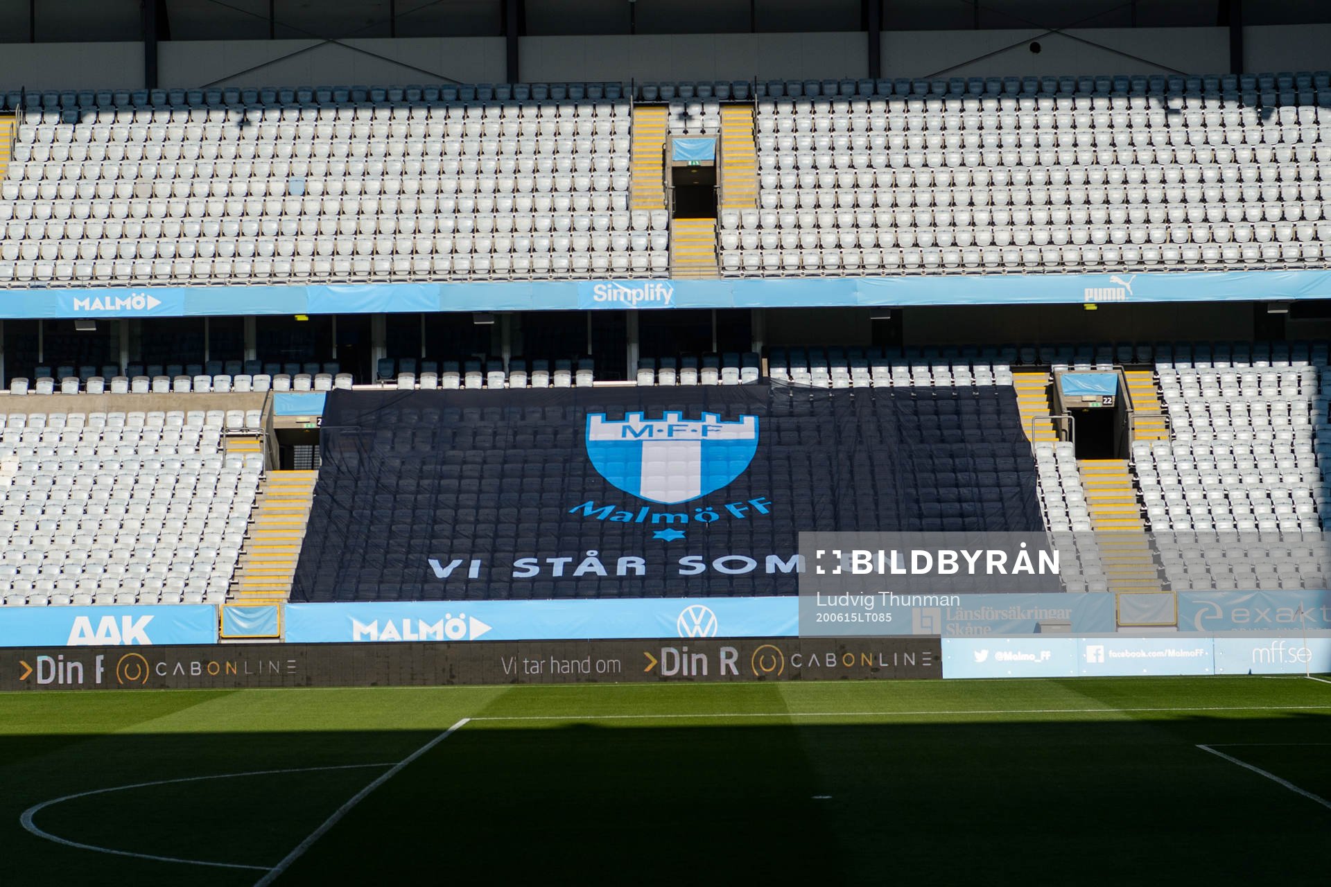 Logotype och slogan vi står som en på en banderoll på