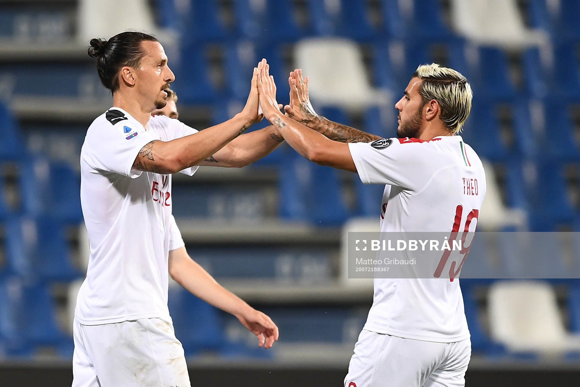 Zlatan Ibrahimovic of AC Milan celebrates with Theo