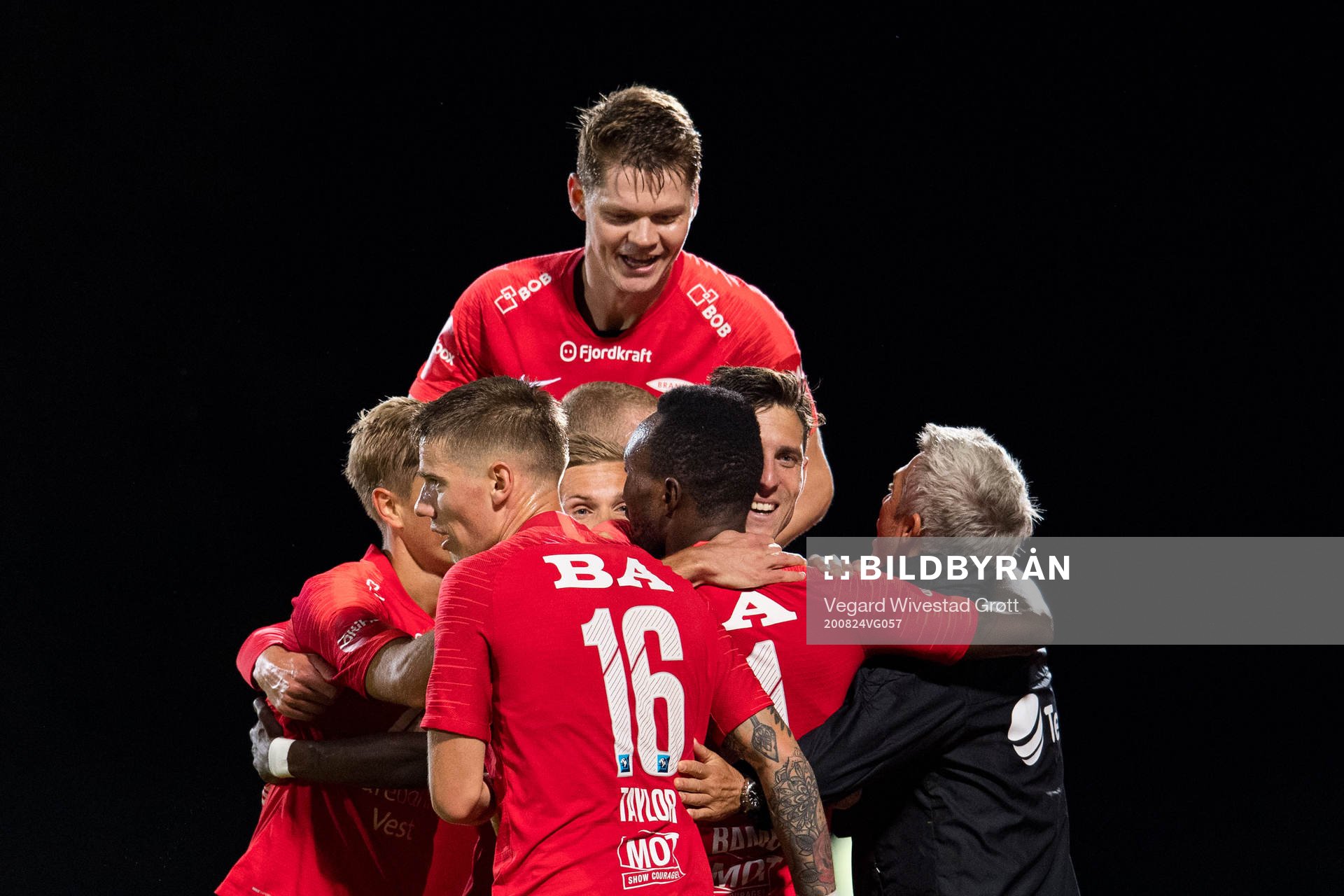 Christian Rismark of Brann celebrates with teammates