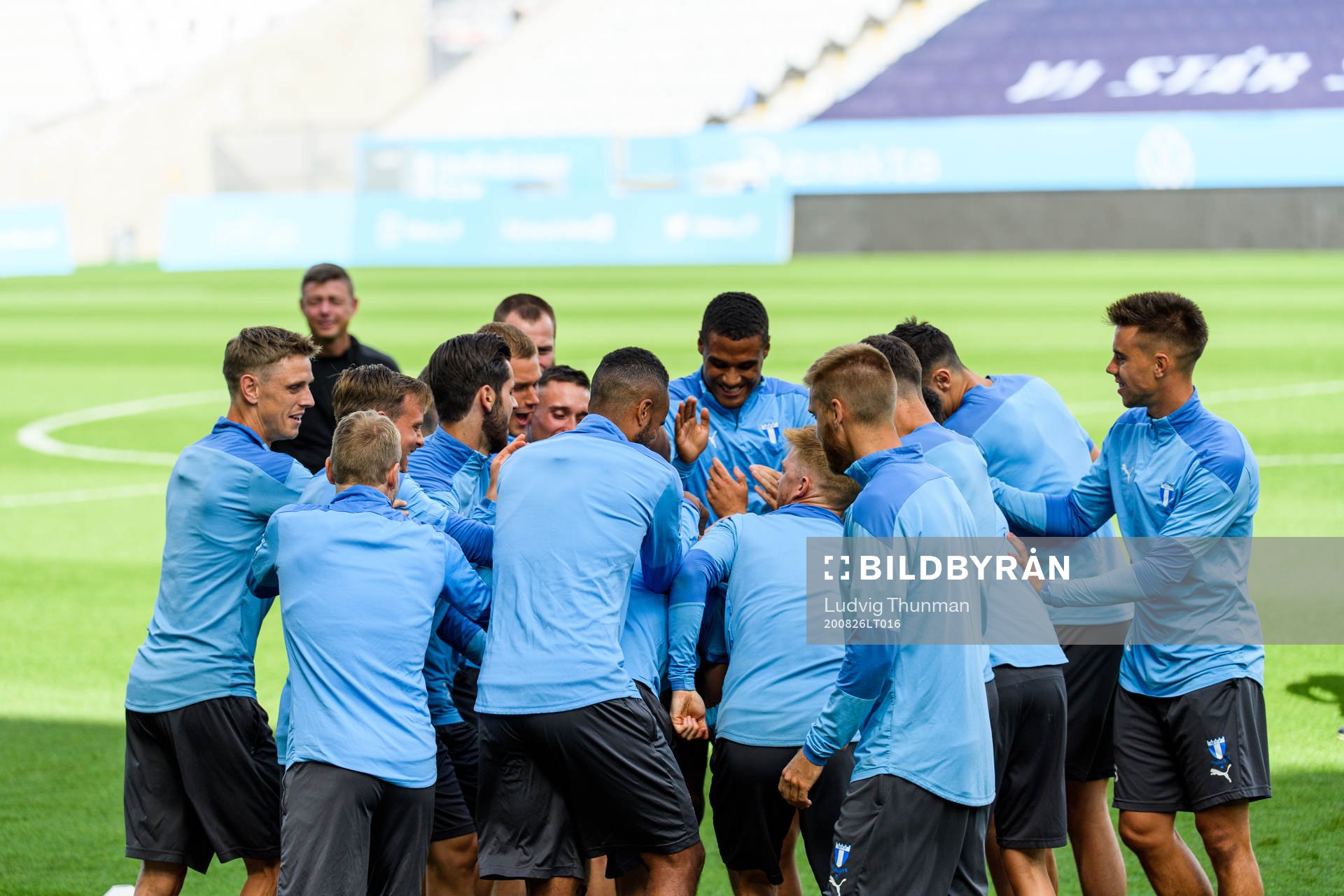 Players of Malmö FF warm up head of a practice and press
