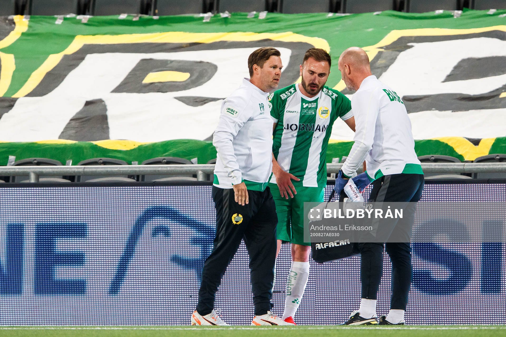 Muamer Tankovic of Hammarby receives help