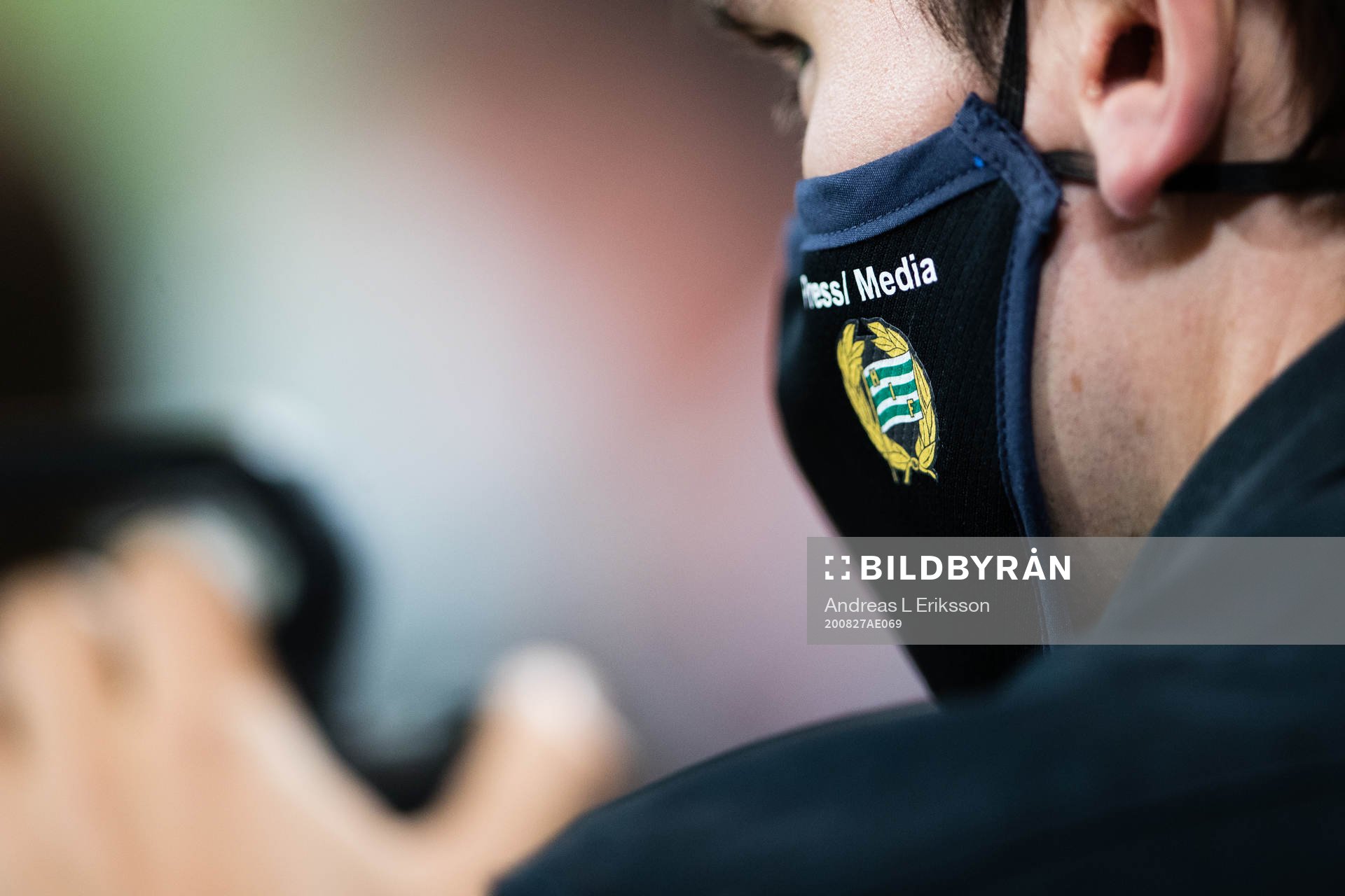A person with a face mask with the Hammarby logo after the UEFA Europa League Qualification match between Hammarby and Puskas Akademia on August 27, 2020 in Stockholm.