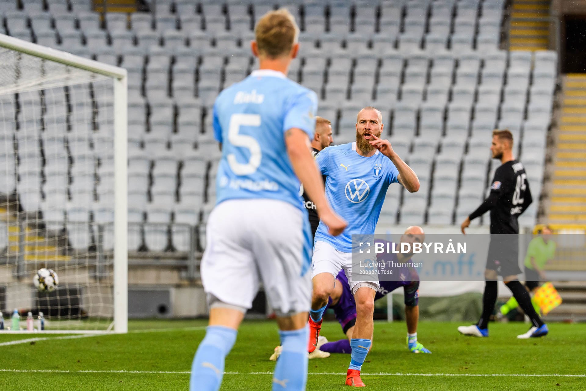 Jo Inge Berget celebrates with Sören Rieks of Malmö FF