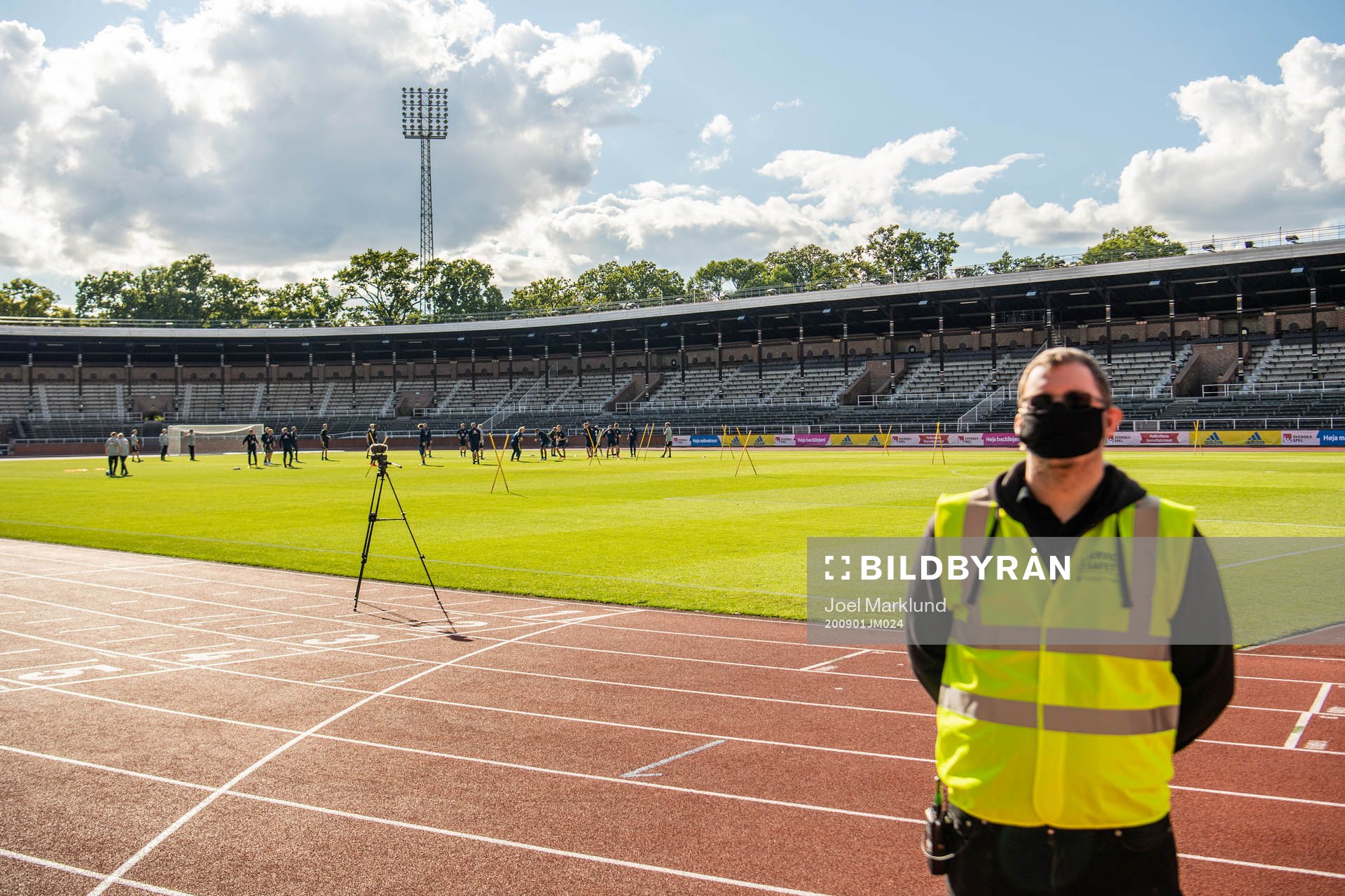 A security guard with a face mask