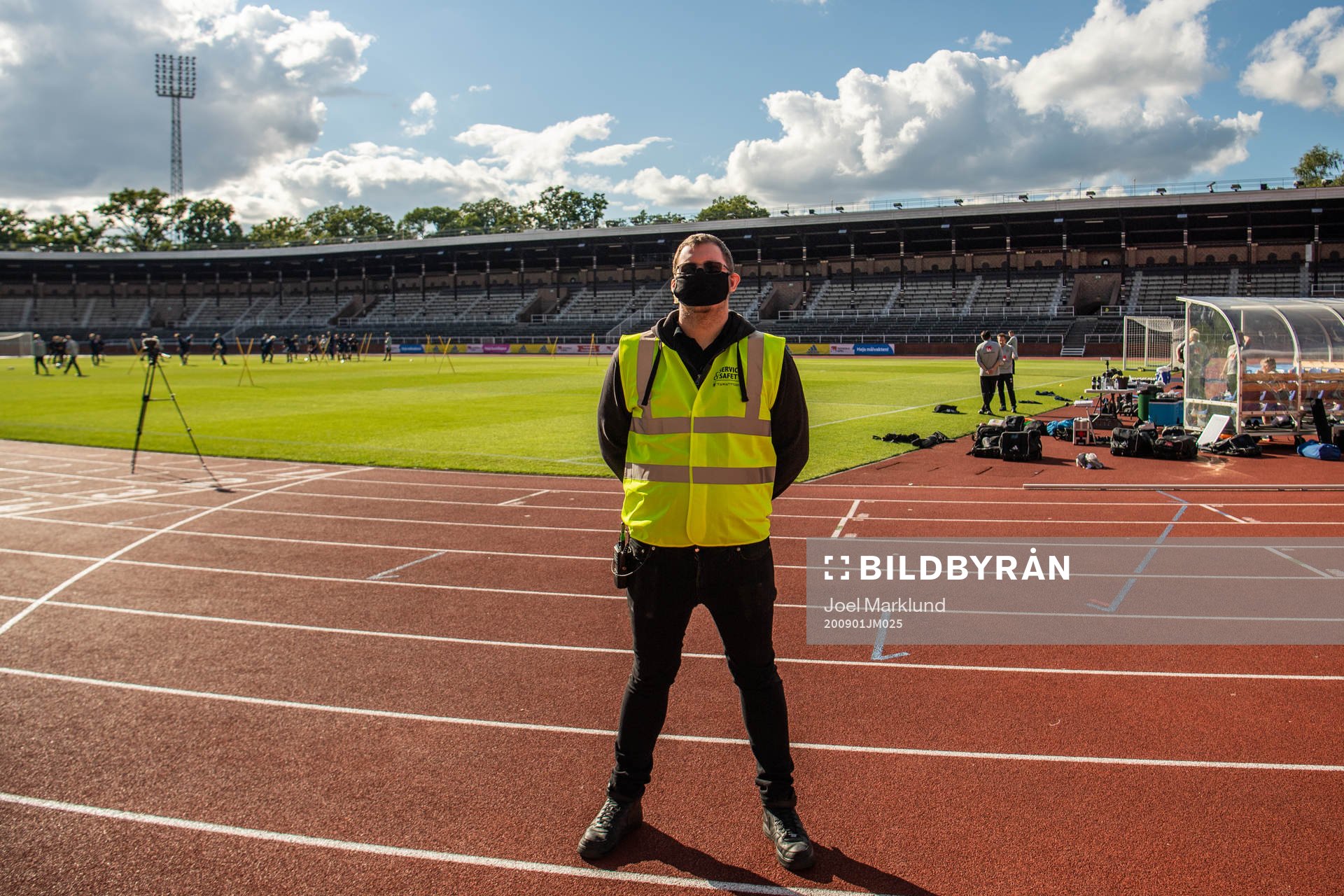 A security guard with a face mask